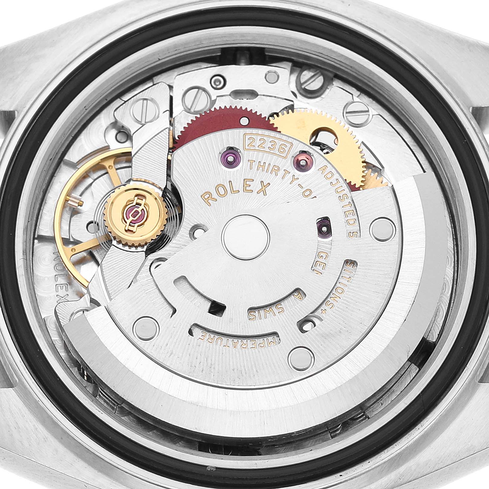 The image shows the movement mechanism of a Rolex Datejust 279160 Women's Stainless Steel White Dial watch from a rear angle, highlighting the rotor and gears.