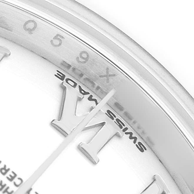 The image shows a close-up of the Rolex Datejust 279160 Women's Stainless Steel White Dial watch, focusing on the bezel and part of the dial with Roman numerals.