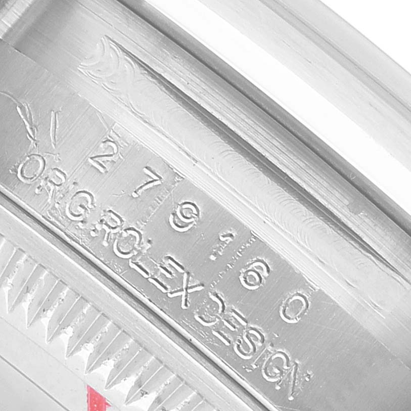 The image shows a close-up of the engraved edge of the Rolex Datejust 279160 Women's Stainless Steel White Dial watch case.