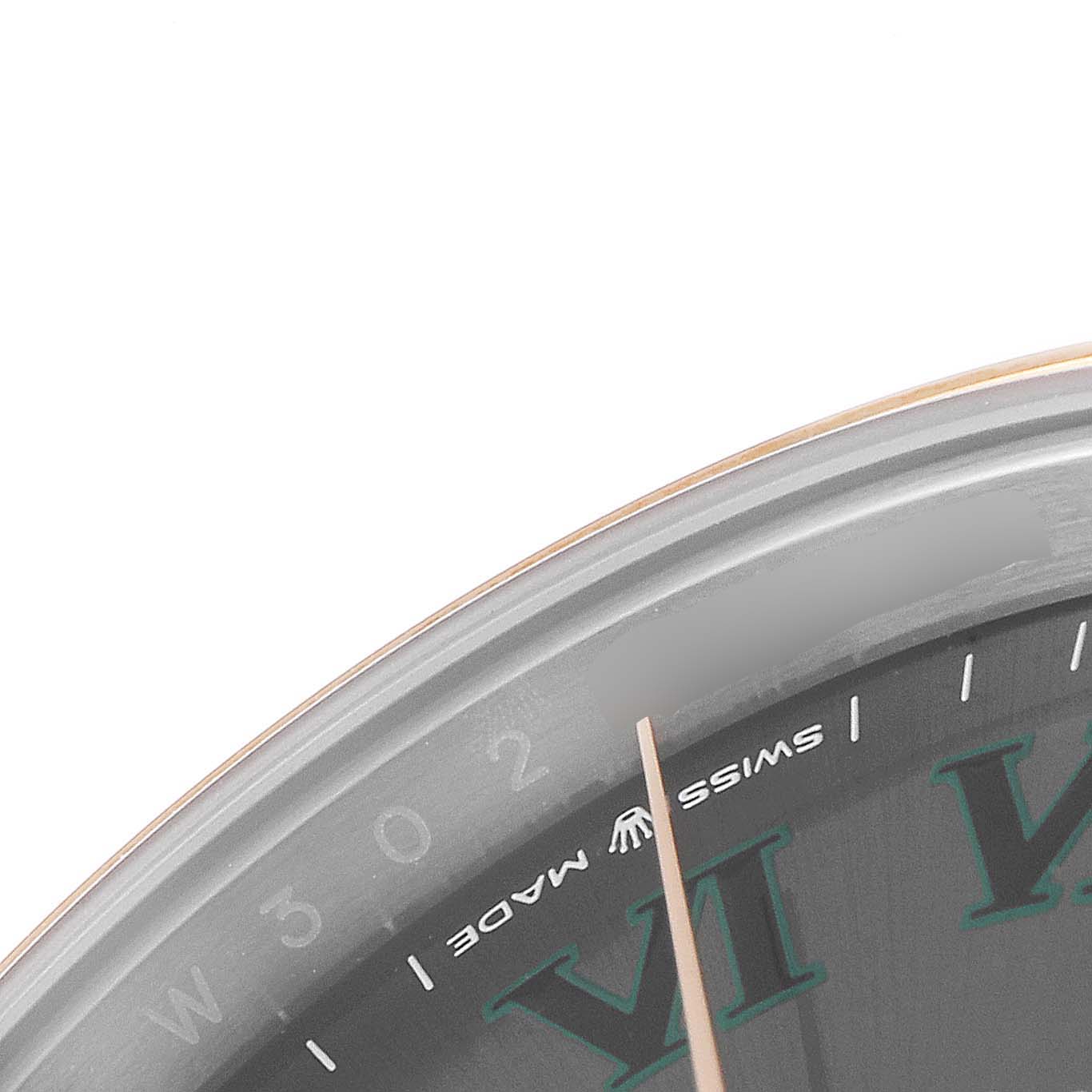 This image shows a close-up of the dial of the Rolex Datejust 41 126301 Men's Steel and Gold (two tone) Grey Dial 126301 Men's Steel and Gold (two tone) Grey Dial watch, focusing on the "Swiss Made" text and part of the watch's markers.