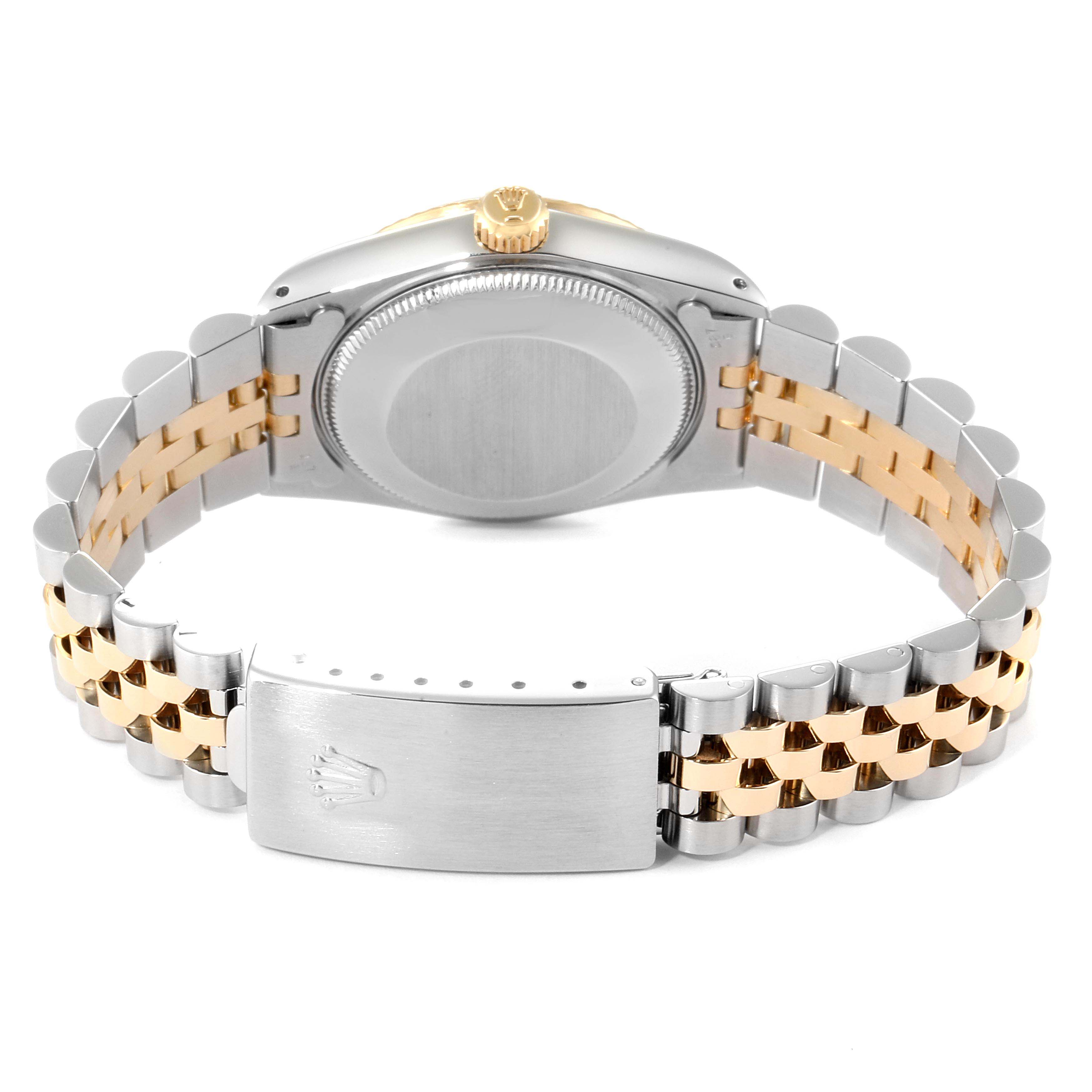 This image shows the backside and clasp of a Rolex Datejust 68273 Women
s Steel and Gold (two tone) Champagne Dial 68273 Women
s Steel and Gold (two tone) Champagne Dial watch, highlighting the two-tone bracelet and closed clasp.