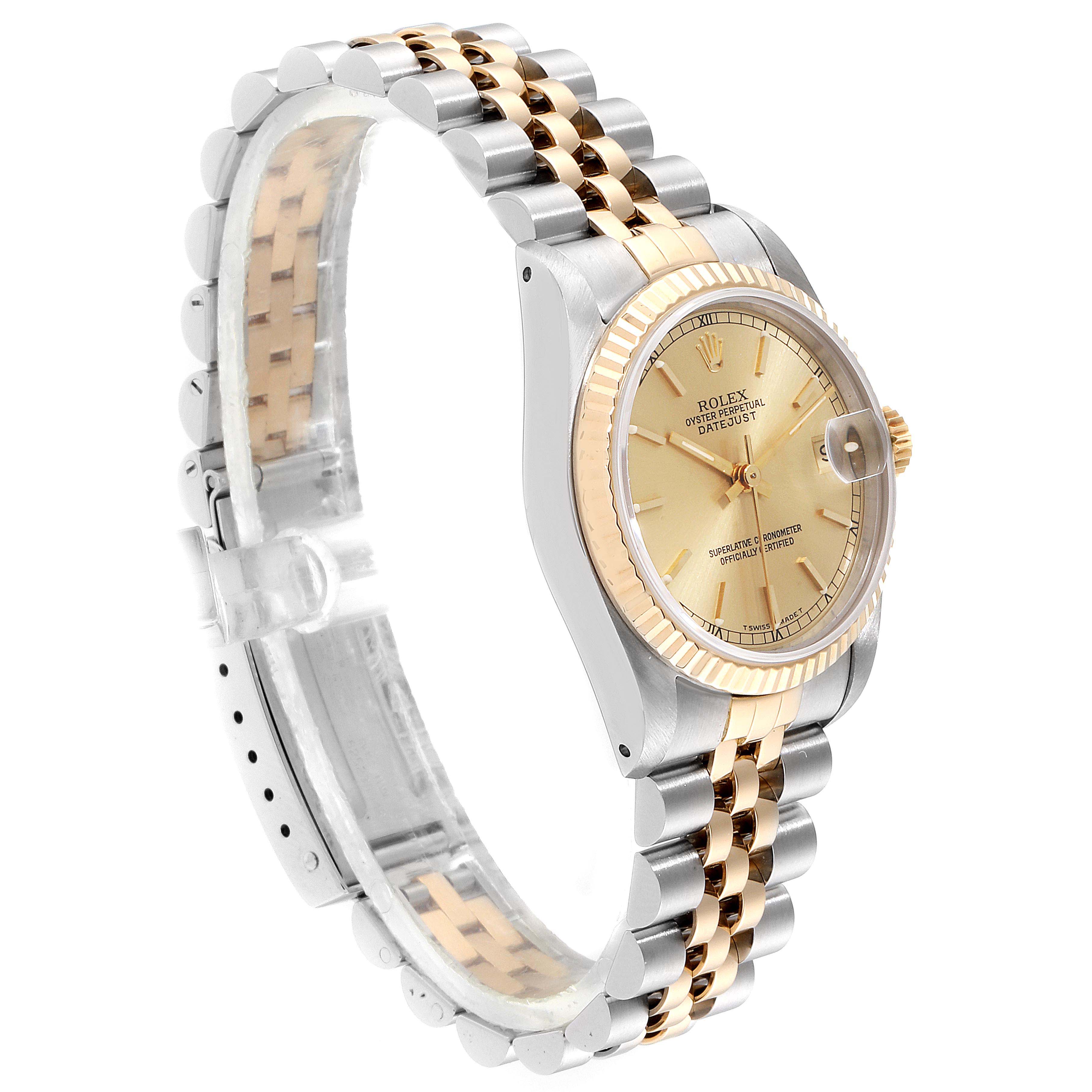 The Rolex Datejust 68273 Women
s Steel and Gold (two tone) Champagne Dial 68273 Women
s Steel and Gold (two tone) Champagne Dial watch is shown at a side angle, highlighting its two-tone bracelet, bezel, and face.