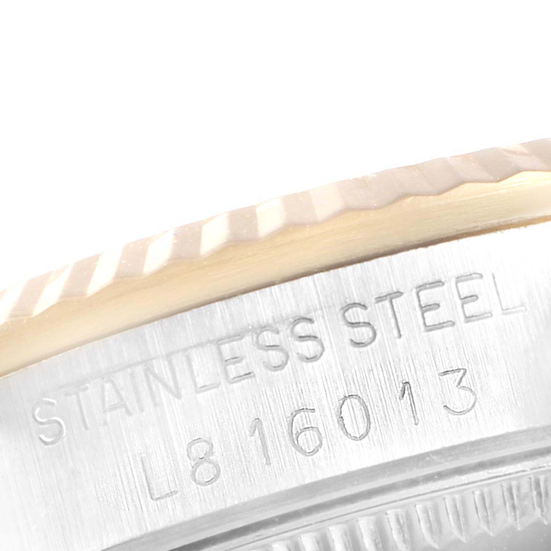 This image shows a close-up of the stainless steel case and bezel of a Rolex Datejust 68273 Women
s Steel and Gold (two tone) Champagne Dial 68273 Women
s Steel and Gold (two tone) Champagne Dial watch.