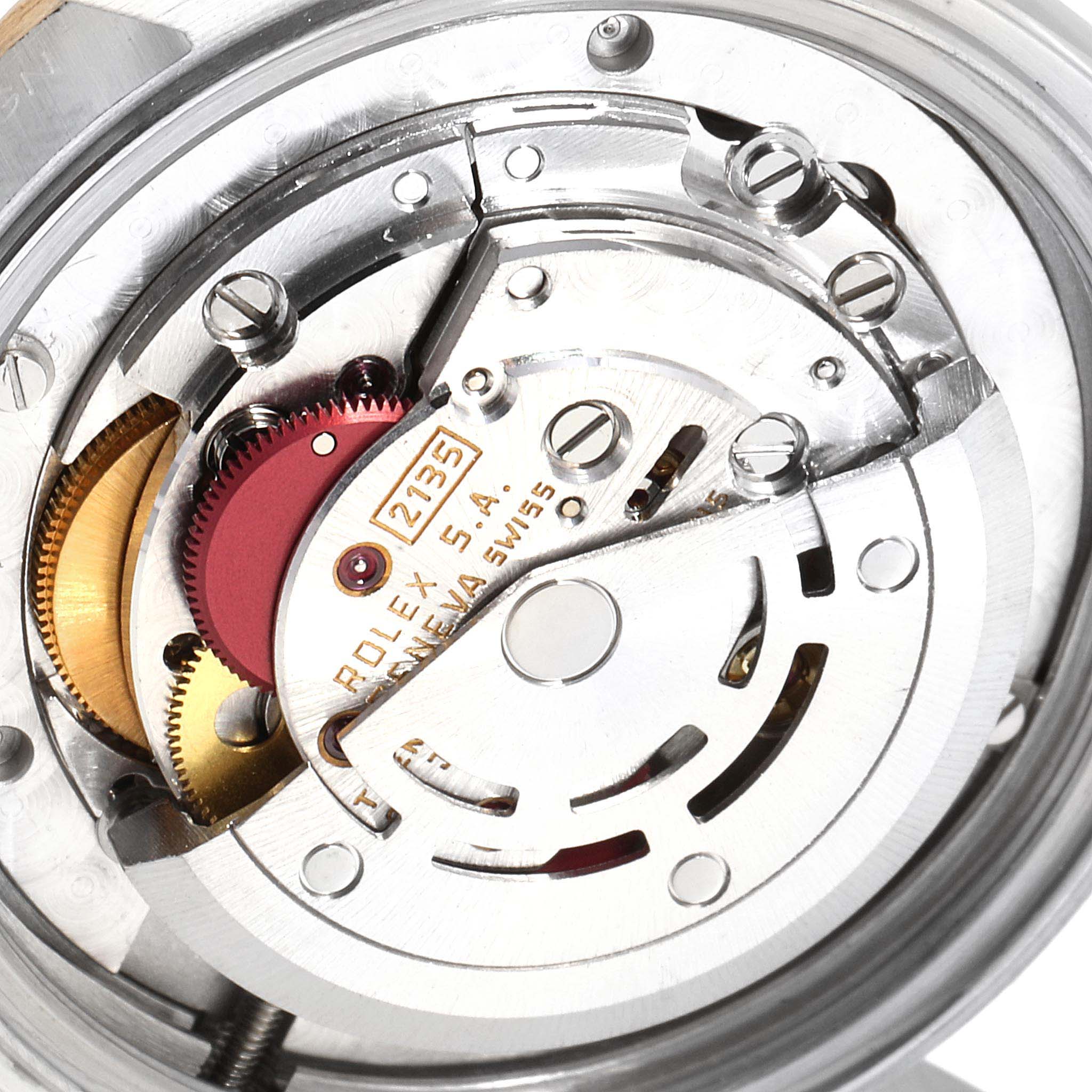 This close-up image displays the intricate movement mechanism of a Rolex Datejust 68273 Women
s Steel and Gold (two tone) Champagne Dial 68273 Women
s Steel and Gold (two tone) Champagne Dial watch, focusing on its gears and inner components.