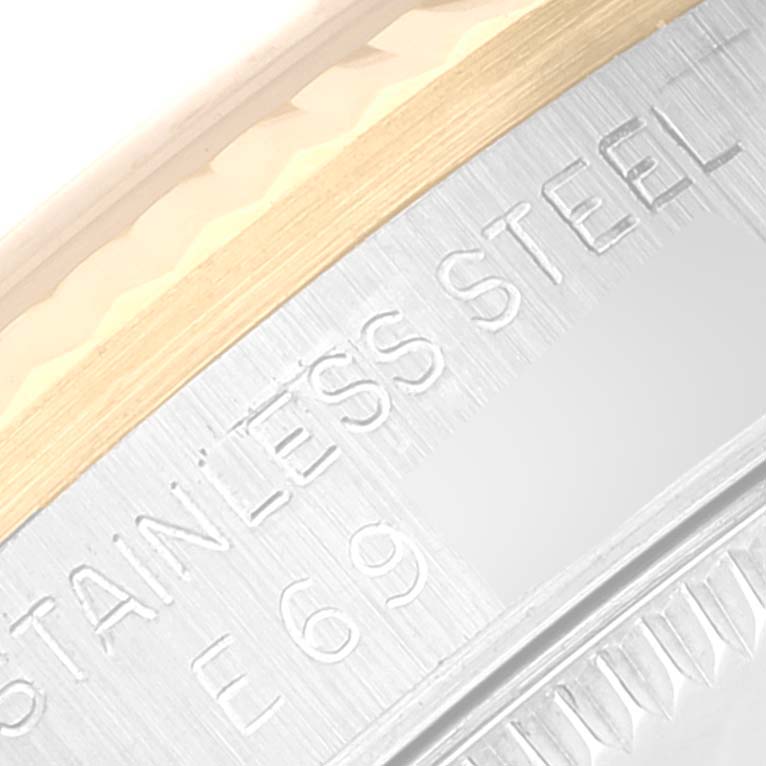This is a close-up image of the case back of a Mid-Size Rolex watch, showing "STAINLESS STEEL" engraving.