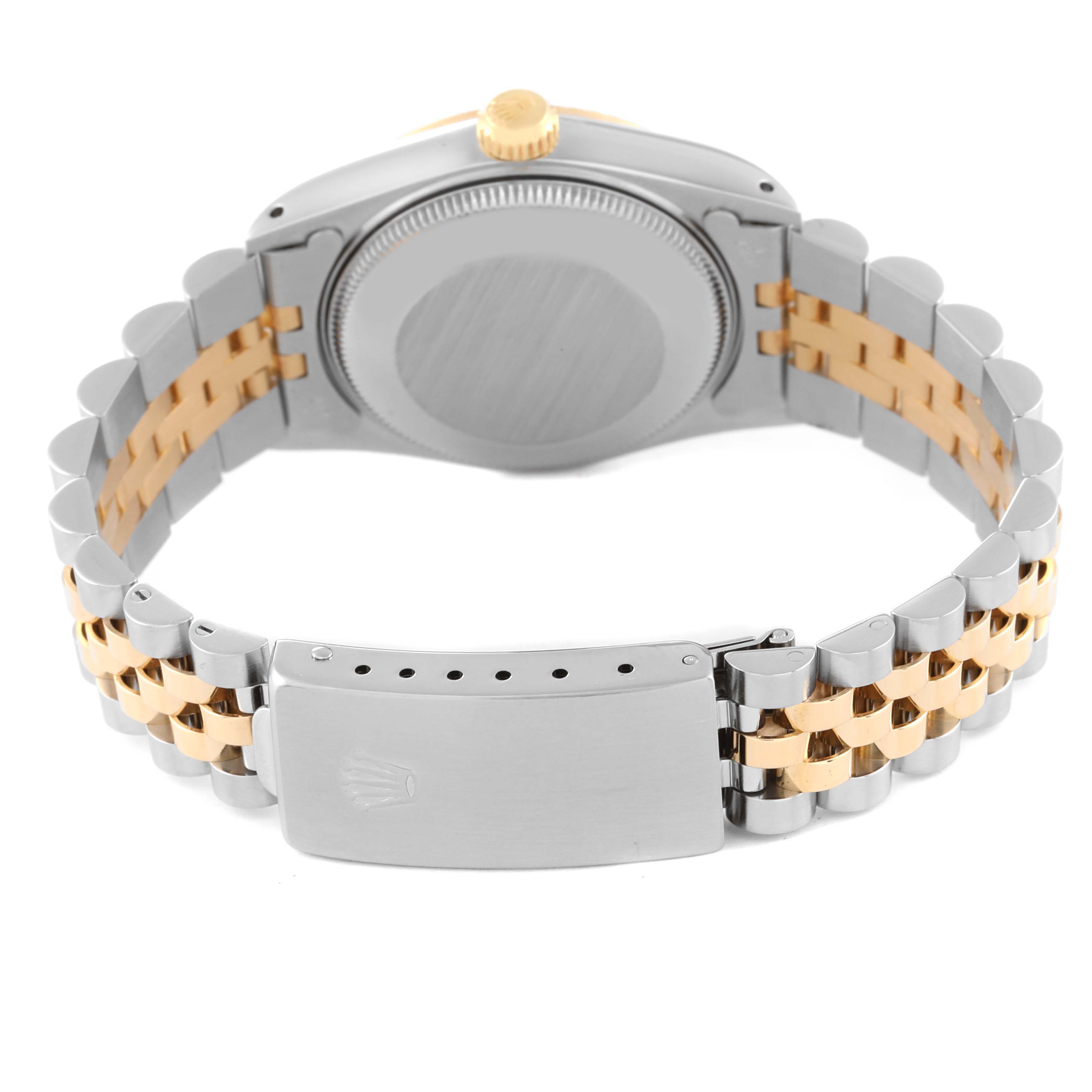 The image shows the back of a Rolex Mid-Size 68273 Women
s Steel and Gold (two tone) Champagne Dial 68273 Women
s Steel and Gold (two tone) Champagne Dial watch, focusing on its case, crown, and Jubilee bracelet with clasp.