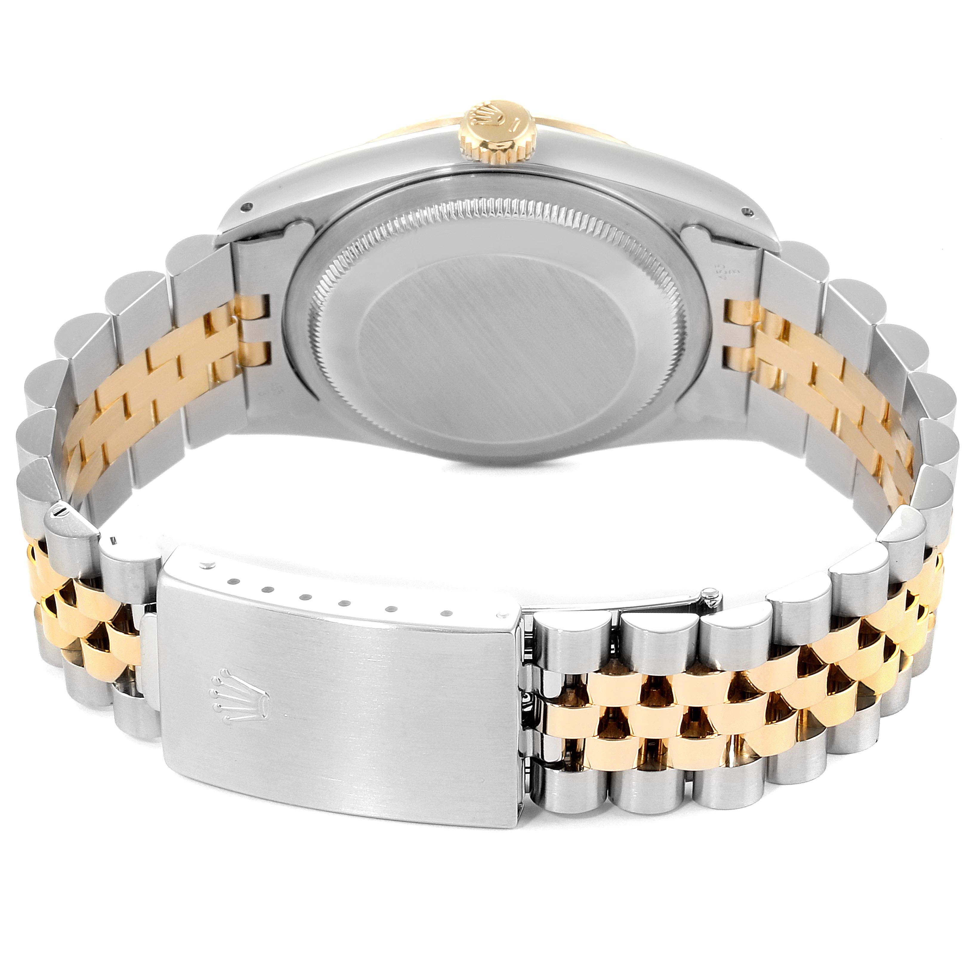 This image shows the back view of a Rolex Datejust 16233 Men
s Steel and Gold (two tone) Champagne Dial 16233 Men
s Steel and Gold (two tone) Champagne Dial watch, highlighting the case back, crown, and the two-tone jubilee bracelet with the clasp.