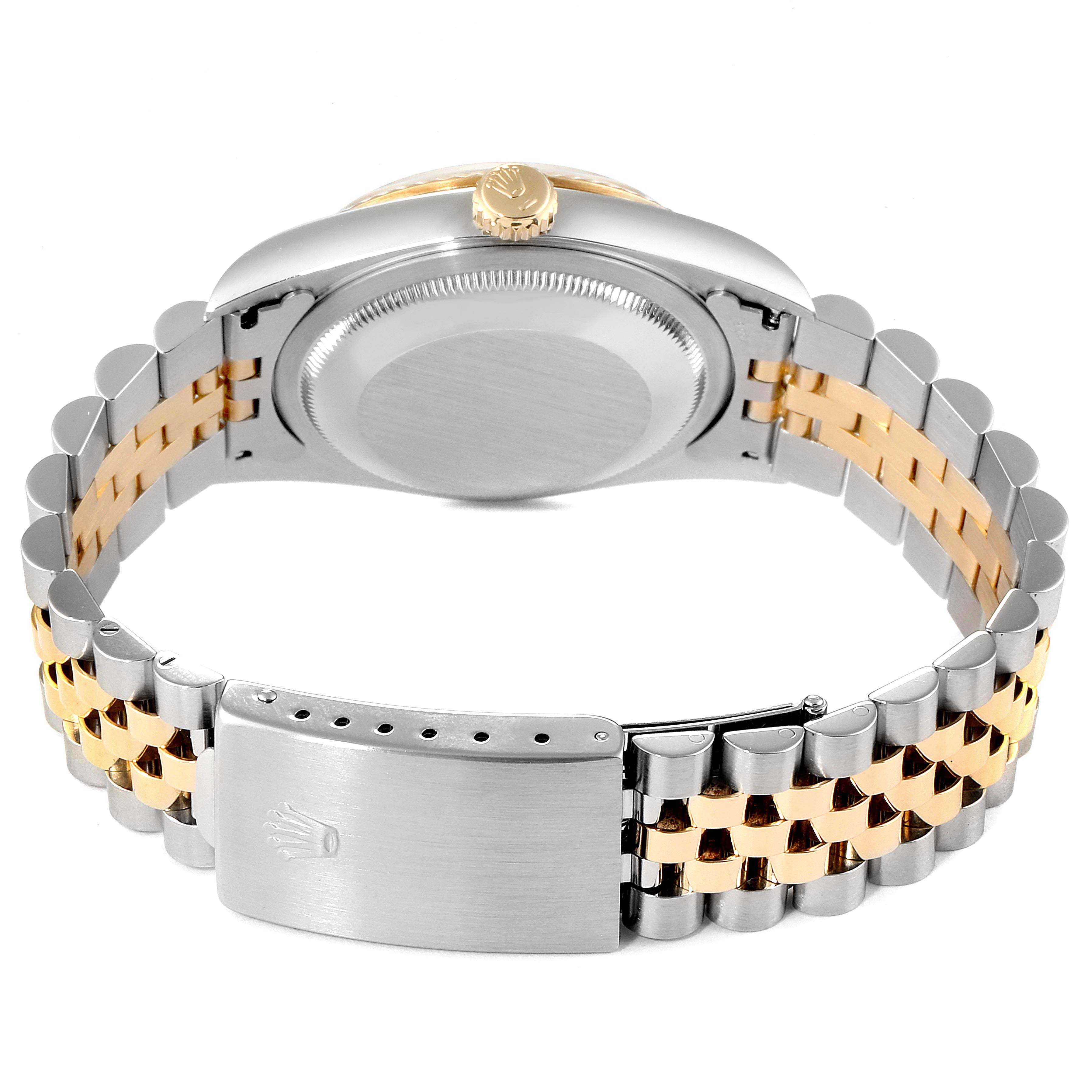 The image shows the back case, crown, and two-tone bracelet of a Rolex Datejust 16233 Men
s Steel and Gold (two tone) Champagne Dial 16233 Men
s Steel and Gold (two tone) Champagne Dial watch, viewed from the rear angle.