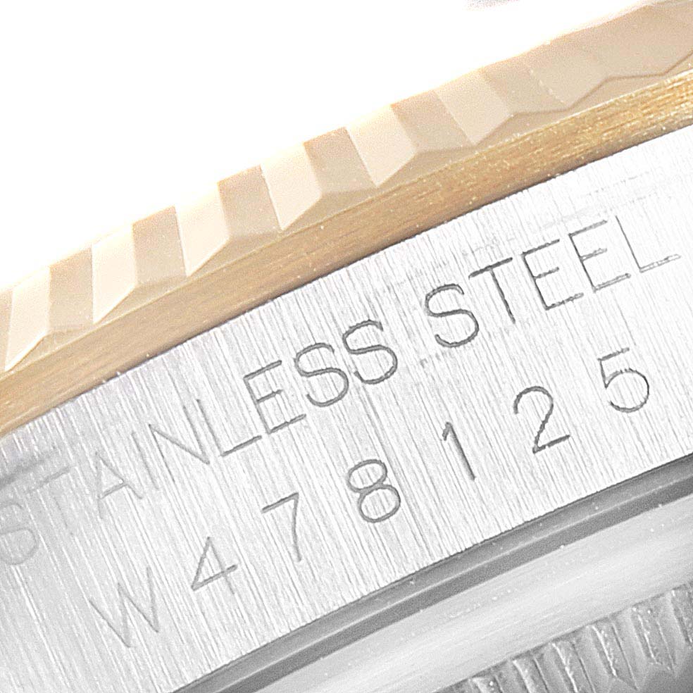 This close-up image shows the stainless steel casing and part of the bezel of a Rolex Datejust 16233 Men
s Steel and Gold (two tone) Champagne Dial 16233 Men
s Steel and Gold (two tone) Champagne Dial watch.