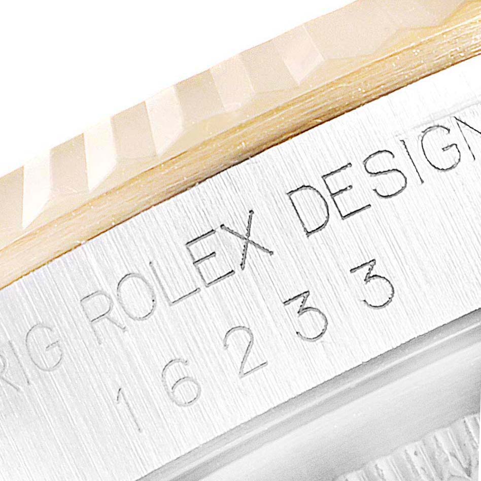 This close-up image shows the engraved model number on the case side of a Rolex Datejust 16233 Men
s Steel and Gold (two tone) Champagne Dial 16233 Men
s Steel and Gold (two tone) Champagne Dial watch.