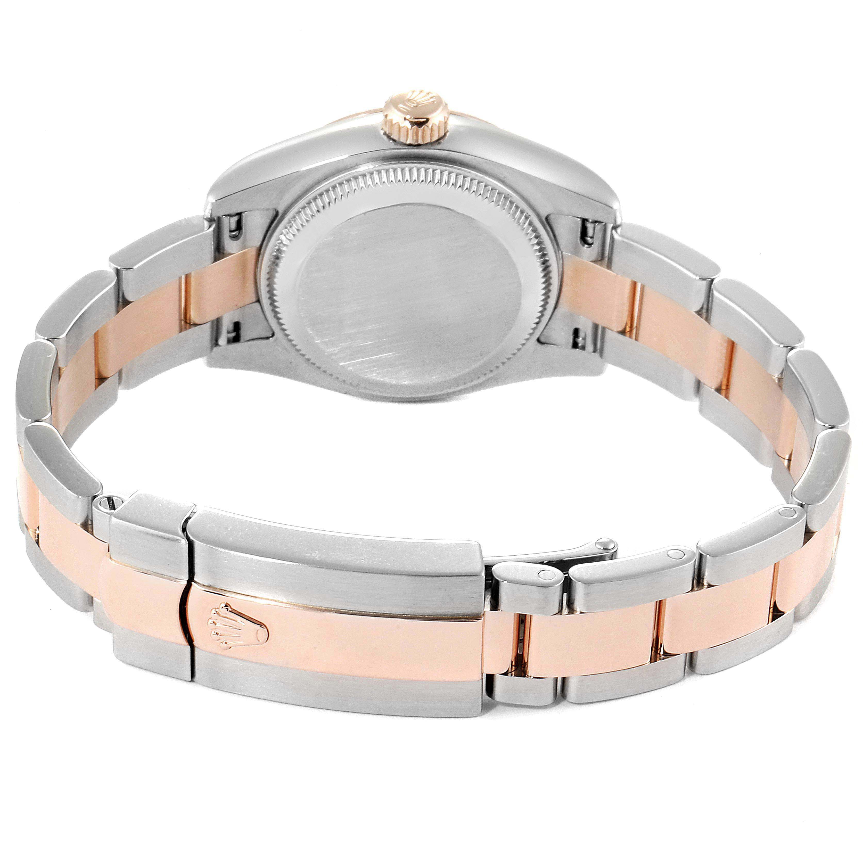 The image shows the back side of a Rolex Datejust 179161 Women
s Steel and Gold (two tone) White Dial 179161 Women
s Steel and Gold (two tone) White Dial watch, focusing on the case back, crown, and bracelet with a clasp.