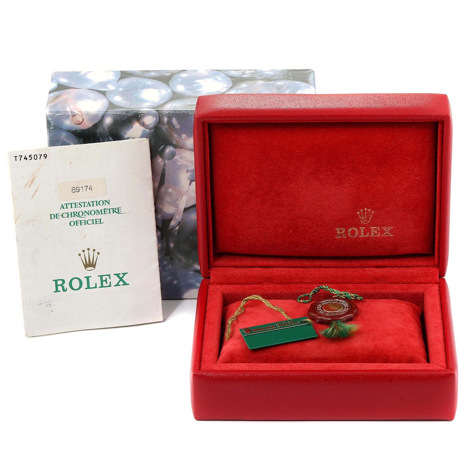 The image shows a Rolex Datejust 69174  Women
s Stainless Steel White Dial 69174  Women
s Stainless Steel White Dial watch box, booklet, and certification tag from a front angle.