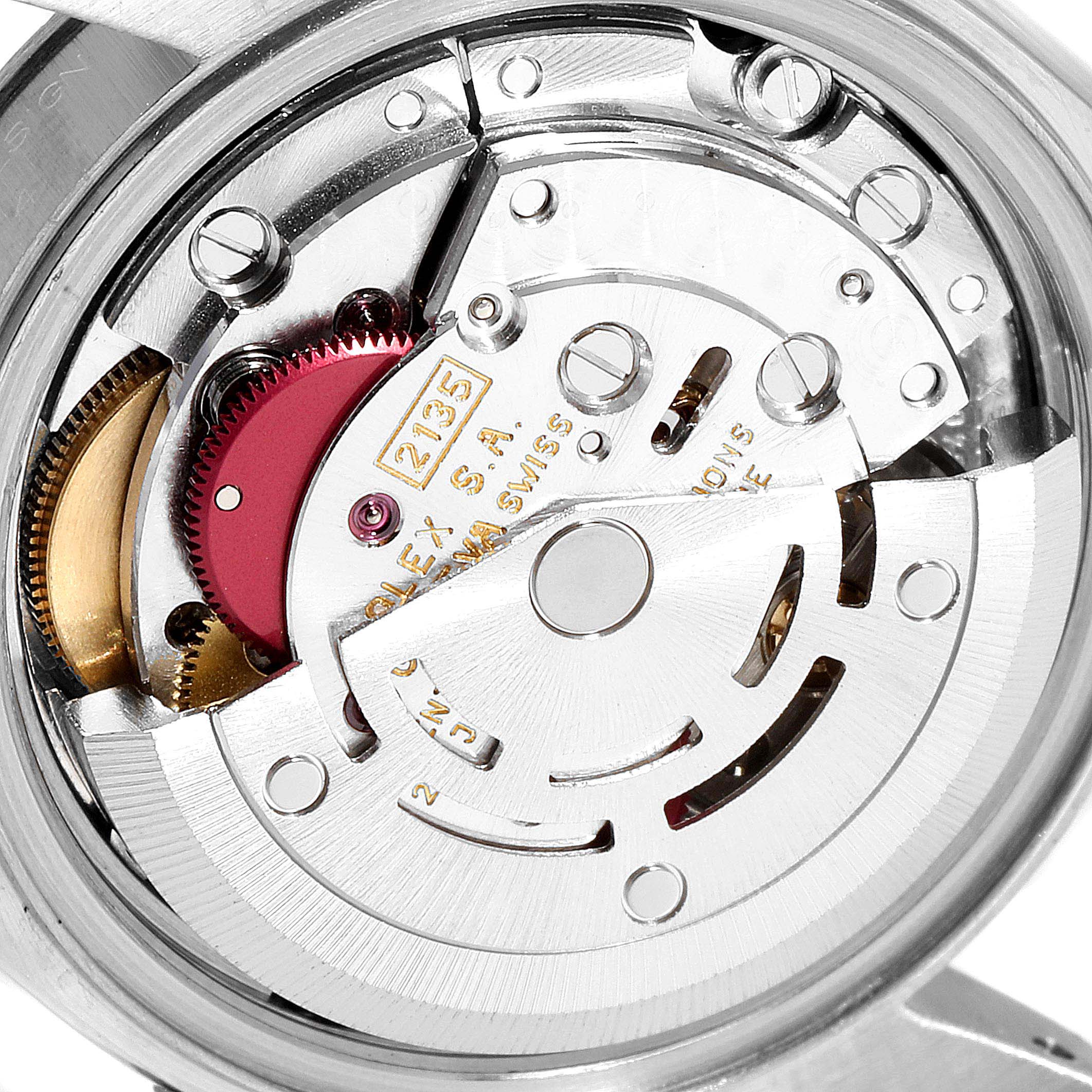 This image shows the internal mechanism of a Rolex Datejust 69174  Women
s Stainless Steel White Dial 69174  Women
s Stainless Steel White Dial watch, including gears and the rotor.