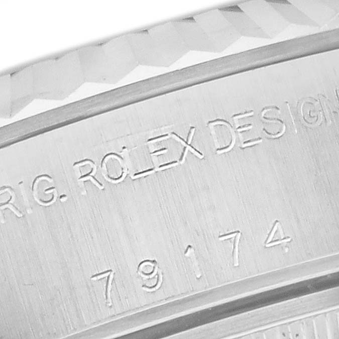 This close-up shot displays the engraved model number and design inscription on the case of a Rolex Datejust 79174 Women's Stainless Steel Silver Dial 79174 Women's Stainless Steel Silver Dial watch.