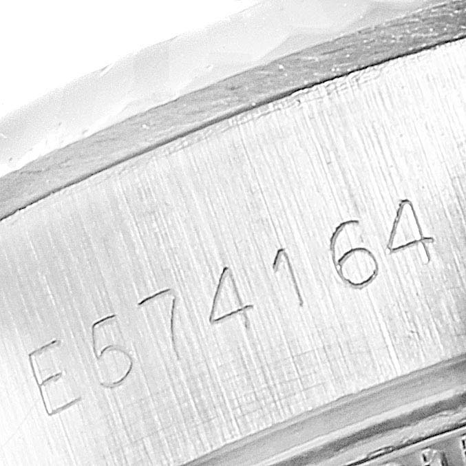 The image shows a close-up of the serial number engraved on the case side of a Rolex Datejust 69174 Women's Steel and Gold (two tone) Silver Dial 69174 Women's Steel and Gold (two tone) Silver Dial watch.