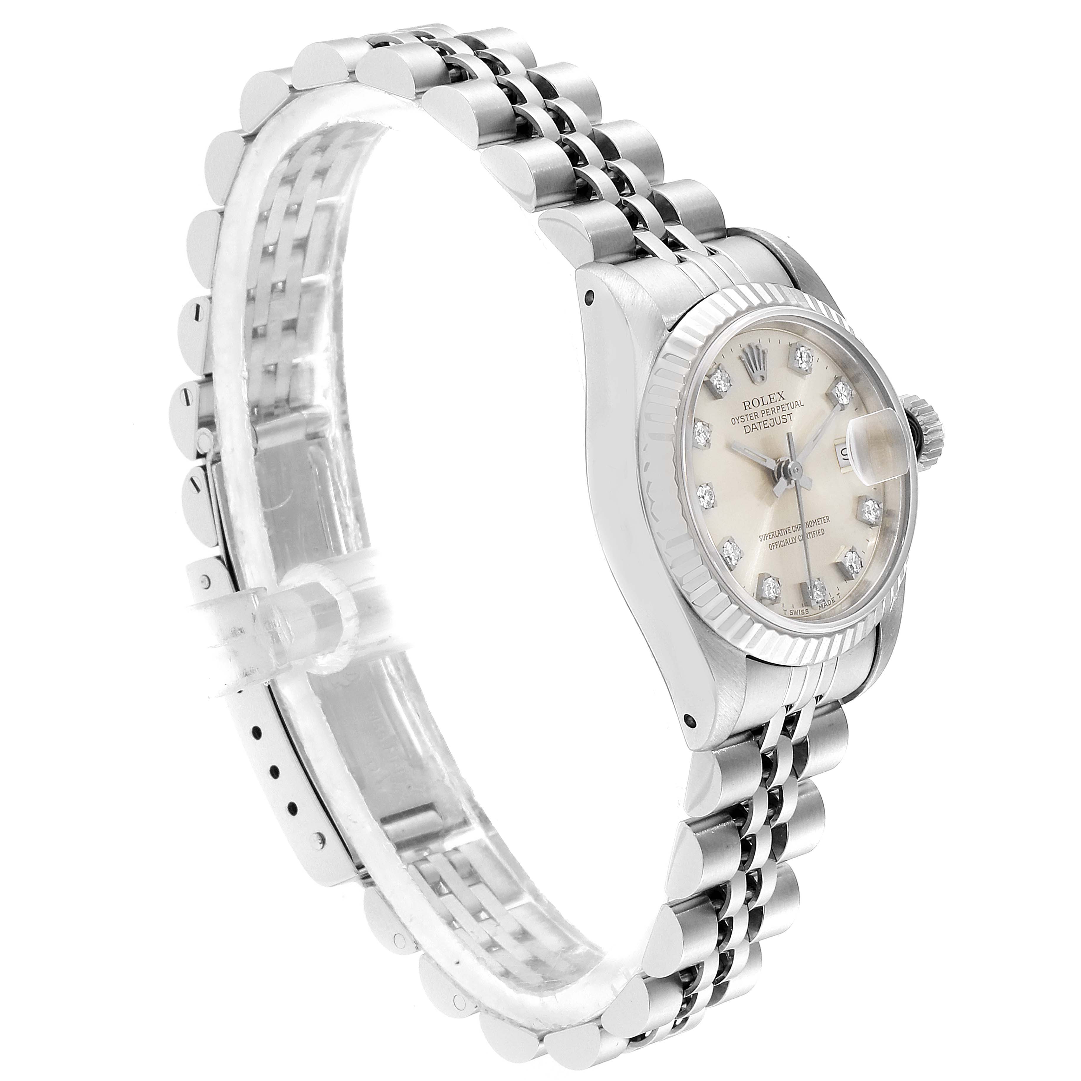 This Rolex Datejust 69174 Women's Steel and Gold (two tone) Silver Dial 69174 Women's Steel and Gold (two tone) Silver Dial watch is shown at an angled side view, displaying the dial, bezel, and jubilee bracelet.