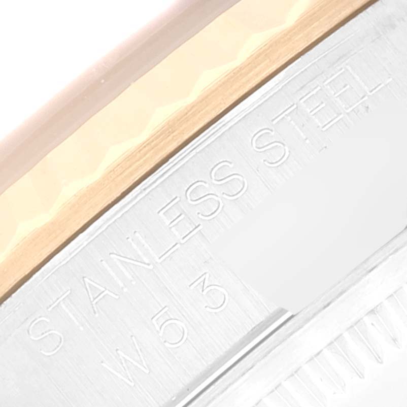 This image shows a close-up of the side engraving on a Rolex Datejust 16233 Men's Steel and Gold (two tone) Black Dial 16233 Men's Steel and Gold (two tone) Black Dial watch emphasizing "STAINLESS STEEL."