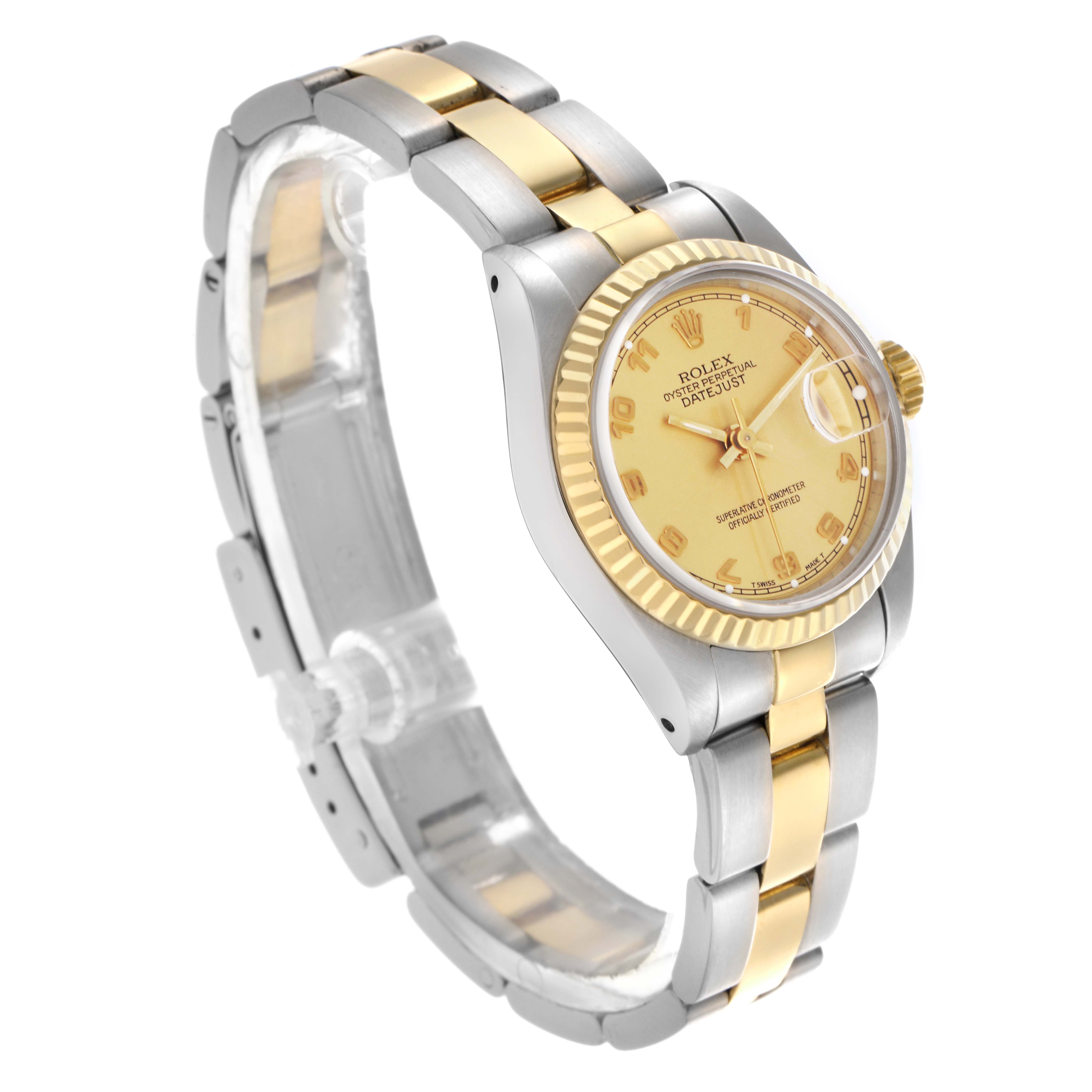 The Rolex Datejust 69173 Women's Steel and Gold (two tone) Champagne Dial 69173 Women's Steel and Gold (two tone) Champagne Dial is shown at a three-quarter angle, highlighting the gold face, fluted bezel, and two-tone bracelet.