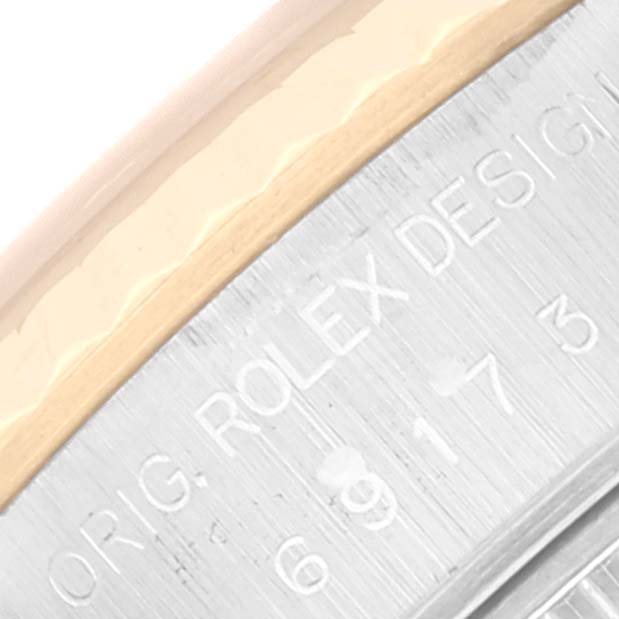 This image shows a close-up view of the case with engravings on the Rolex Datejust 69173 Women's Steel and Gold (two tone) Champagne Dial 69173 Women's Steel and Gold (two tone) Champagne Dial watch.