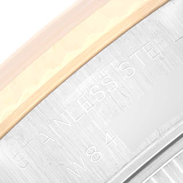 This image shows a close-up of the stainless steel and gold bezel of a Rolex Datejust 69173 Women's Steel and Gold (two tone) Champagne Dial 69173 Women's Steel and Gold (two tone) Champagne Dial watch.