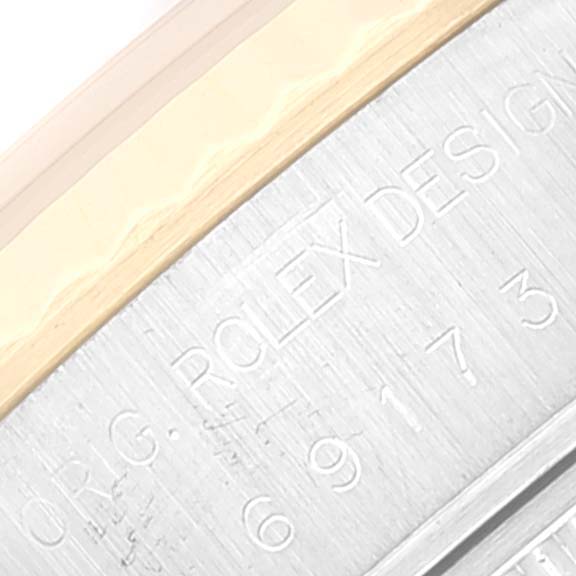 This close-up image shows the side engraving on the bezel of a Rolex Datejust 69173 Women's Steel and Gold (two tone) Champagne Dial 69173 Women's Steel and Gold (two tone) Champagne Dial watch.