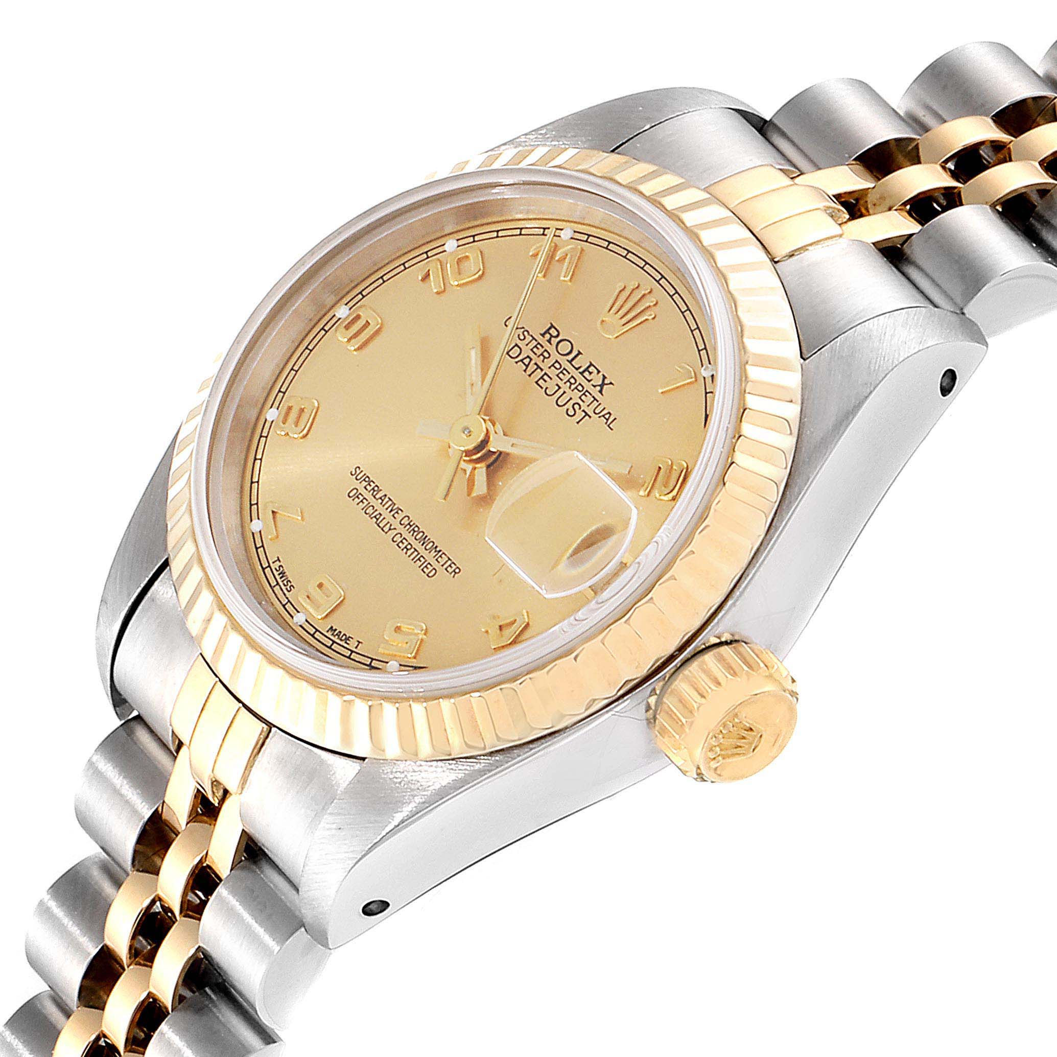 The Rolex Datejust 69173 Women
s Steel and Gold (two tone) Champagne Dial 69173 Women
s Steel and Gold (two tone) Champagne Dial watch is shown at an oblique angle, highlighting its dial, bezel, crown, and part of the bracelet.