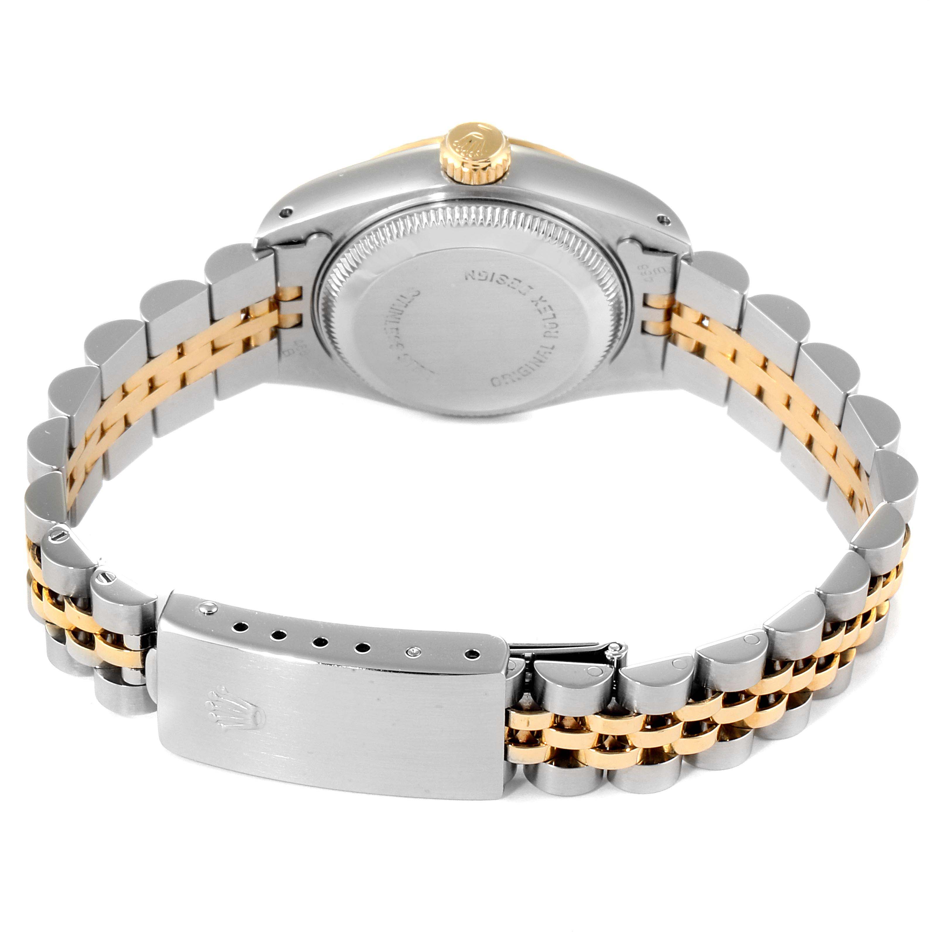 The image shows the back view of a Rolex Datejust 69173 Women
s Steel and Gold (two tone) Champagne Dial 69173 Women
s Steel and Gold (two tone) Champagne Dial watch with its bracelet, clasp, and case back visible.