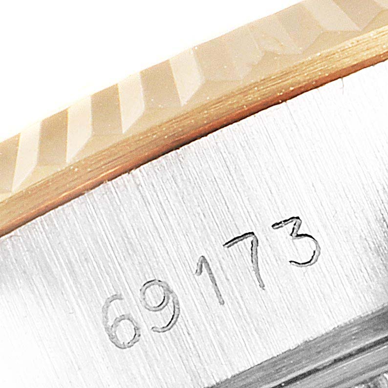 This close-up image shows the bezel and the serial number of a Rolex Datejust 69173 Women
s Steel and Gold (two tone) Champagne Dial 69173 Women
s Steel and Gold (two tone) Champagne Dial watch.