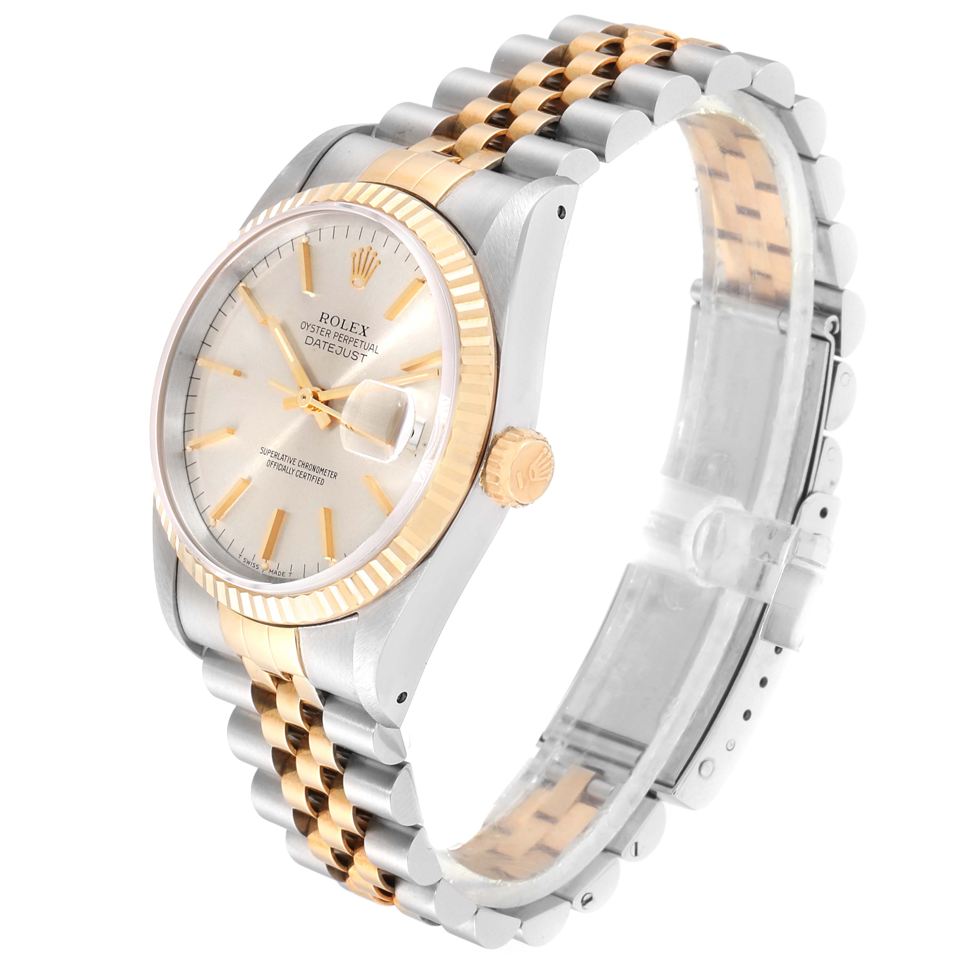 The Rolex Datejust 16233 Men
s Steel and Gold (two tone) Silver Dial 16233 Men
s Steel and Gold (two tone) Silver Dial watch is shown at a three-quarter angle displaying its dial, fluted bezel, and two-tone Jubilee bracelet.