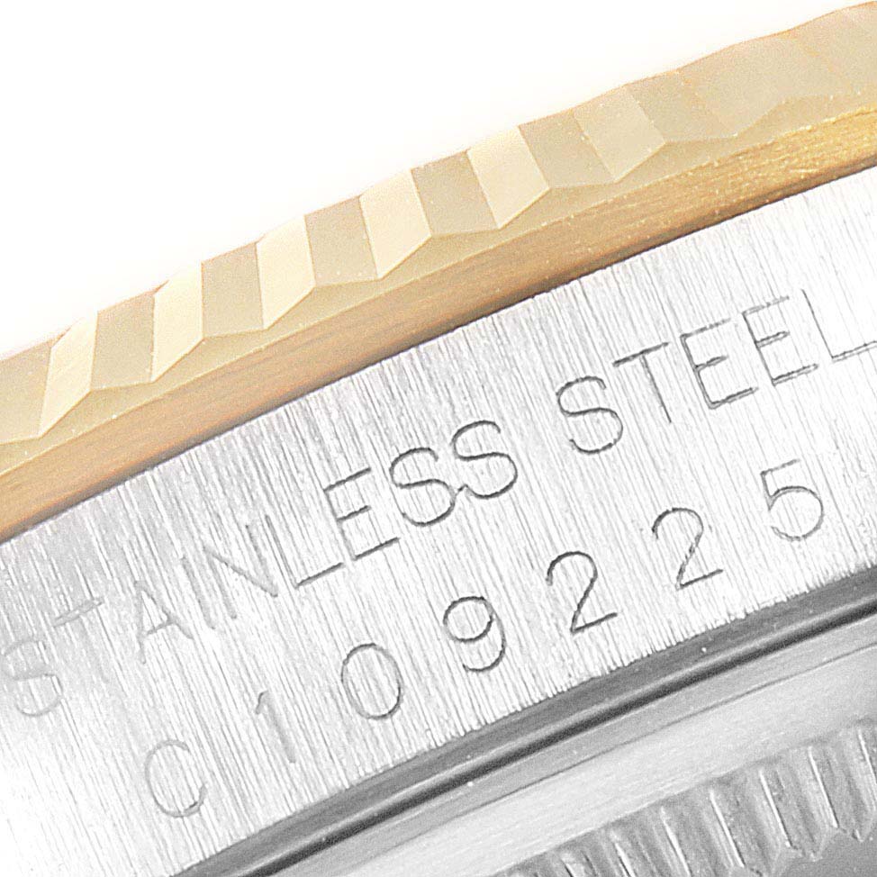 The image shows a close-up of the bezel and caseback engraving of a Rolex Datejust 16233 Men
s Steel and Gold (two tone) Silver Dial 16233 Men
s Steel and Gold (two tone) Silver Dial watch.