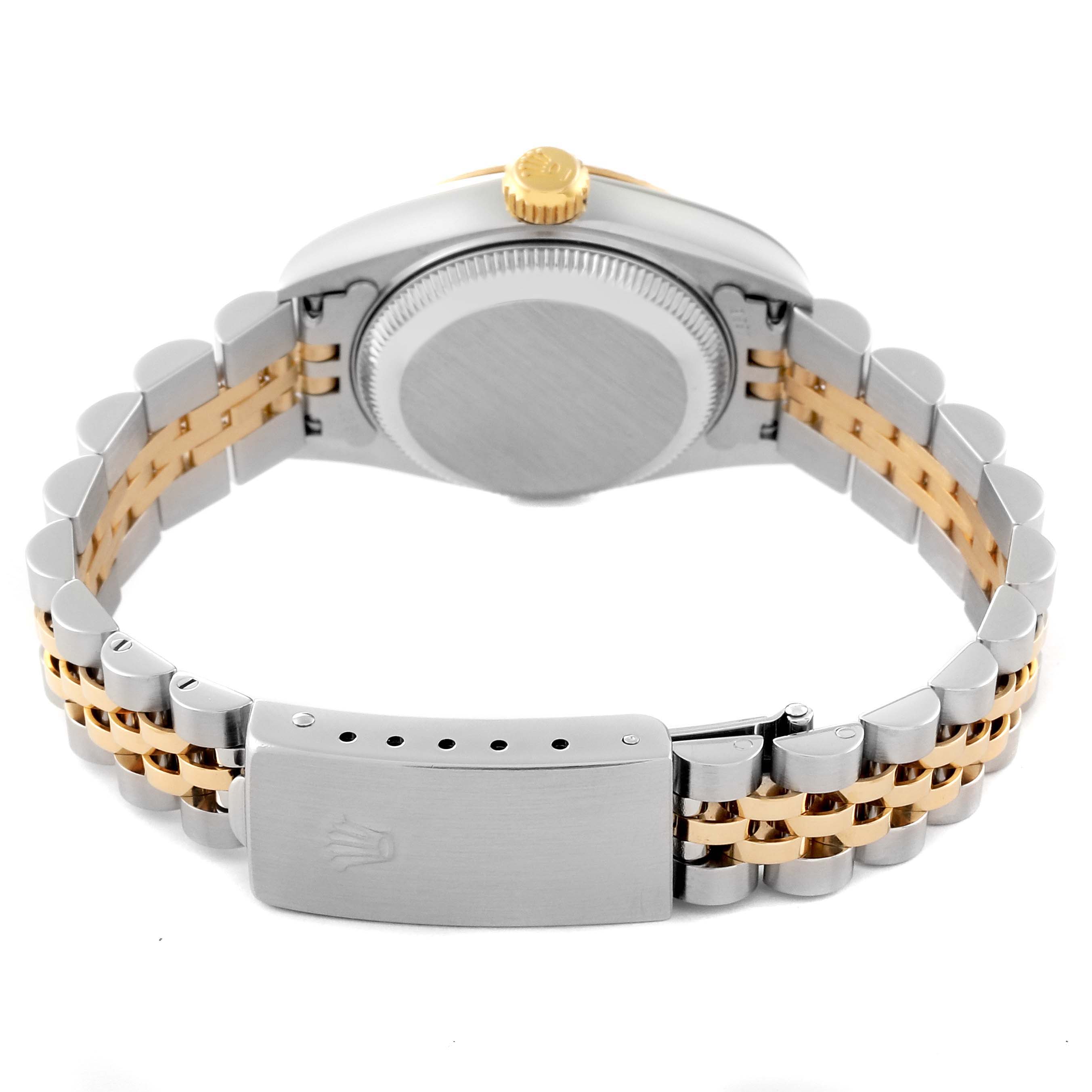 This image shows the back side of the Rolex Datejust 79173 Women's Steel and Gold (two tone) Red Dial 79173 Women's Steel and Gold (two tone) Red Dial watch, highlighting its case back, crown, and two-tone metal bracelet with clasp.