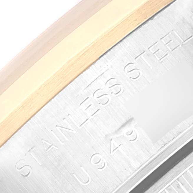 The image shows a close-up of the side of a Rolex Datejust 69163 Women's Steel and Gold (two tone) Grey Dial 69163 Women's Steel and Gold (two tone) Grey Dial watch, highlighting the stainless steel material and part of the serial number.