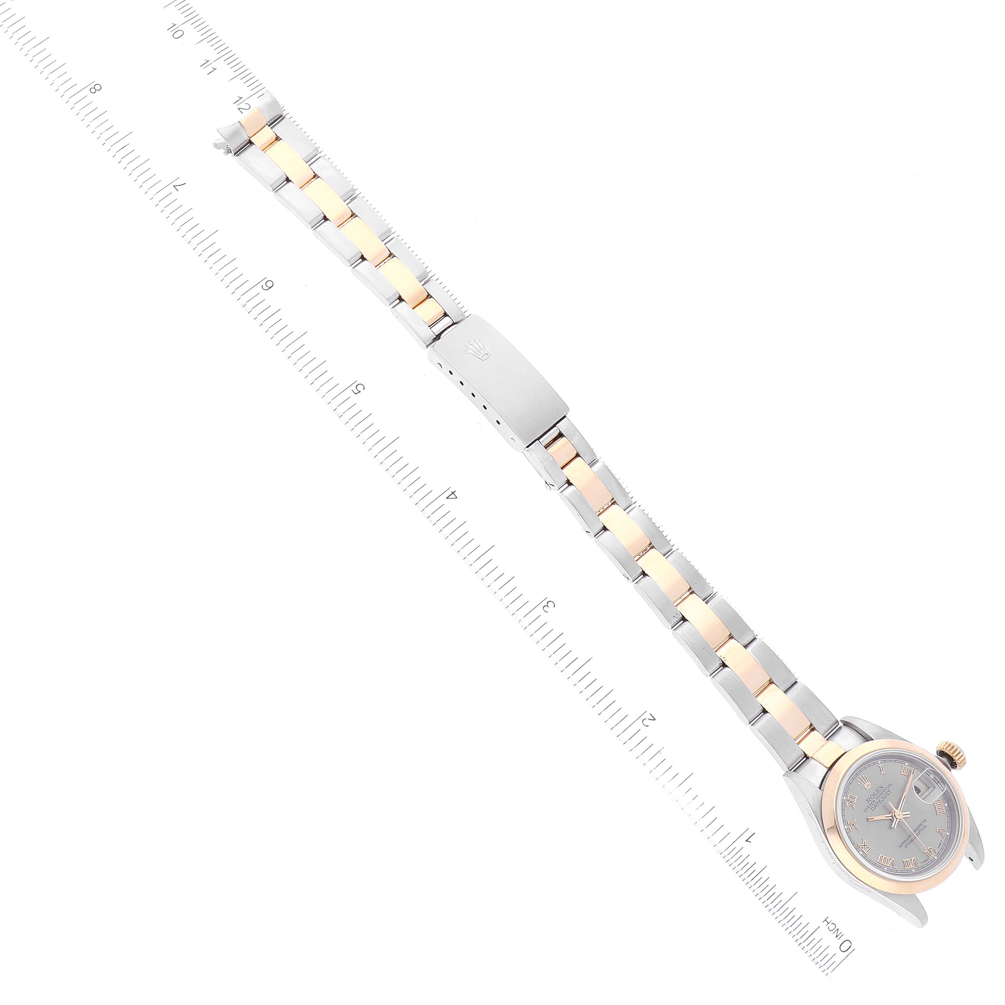 The image shows a top-down view of a Rolex Datejust 69163 Women's Steel and Gold (two tone) Grey Dial 69163 Women's Steel and Gold (two tone) Grey Dial watch, highlighting the face, bezel, bracelet, and clasp.