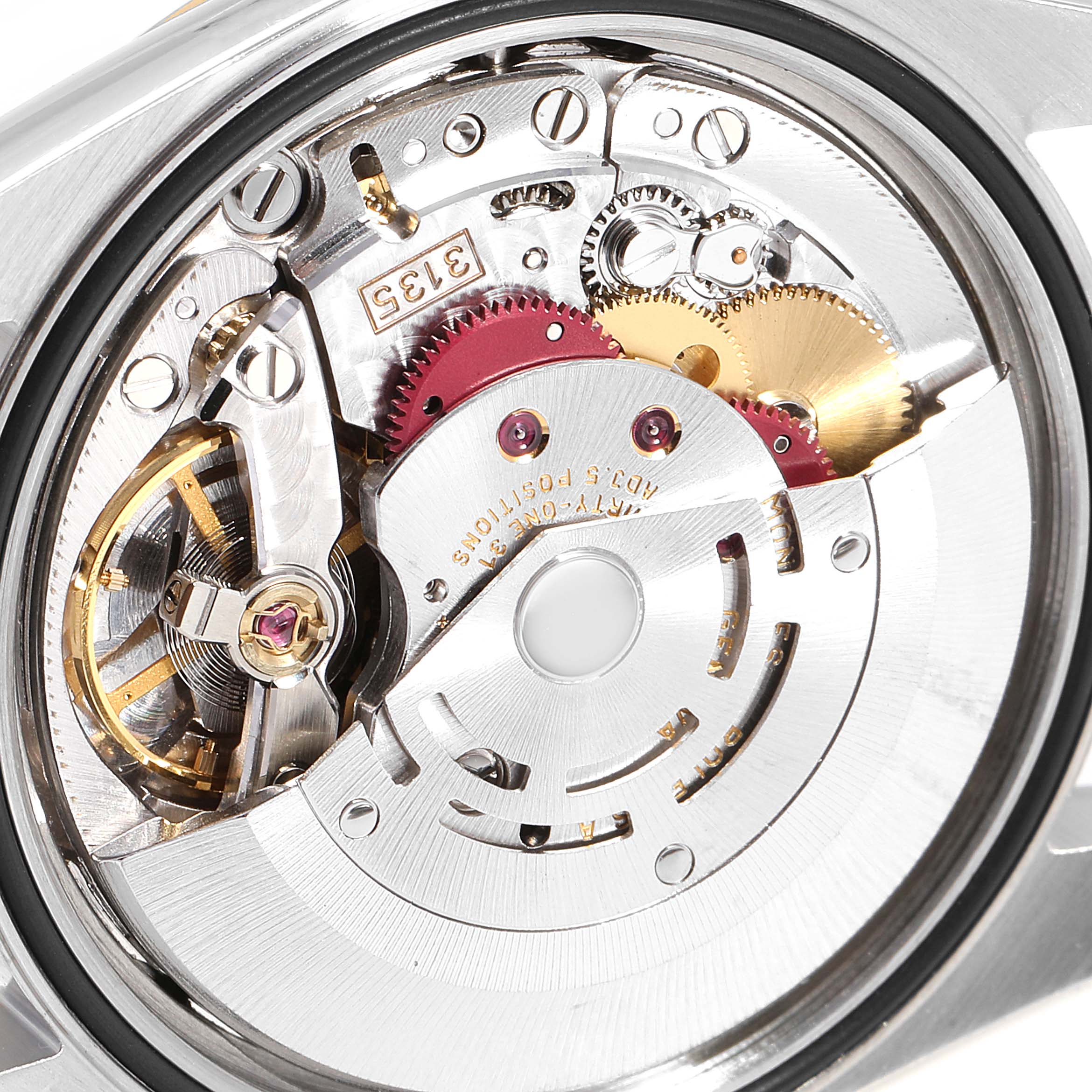 The image shows the intricate mechanical movement and inner workings of a Rolex Datejust 16233 Men
s Steel and Gold (two tone) White Dial 16233 Men
s Steel and Gold (two tone) White Dial watch from a close-up angle.