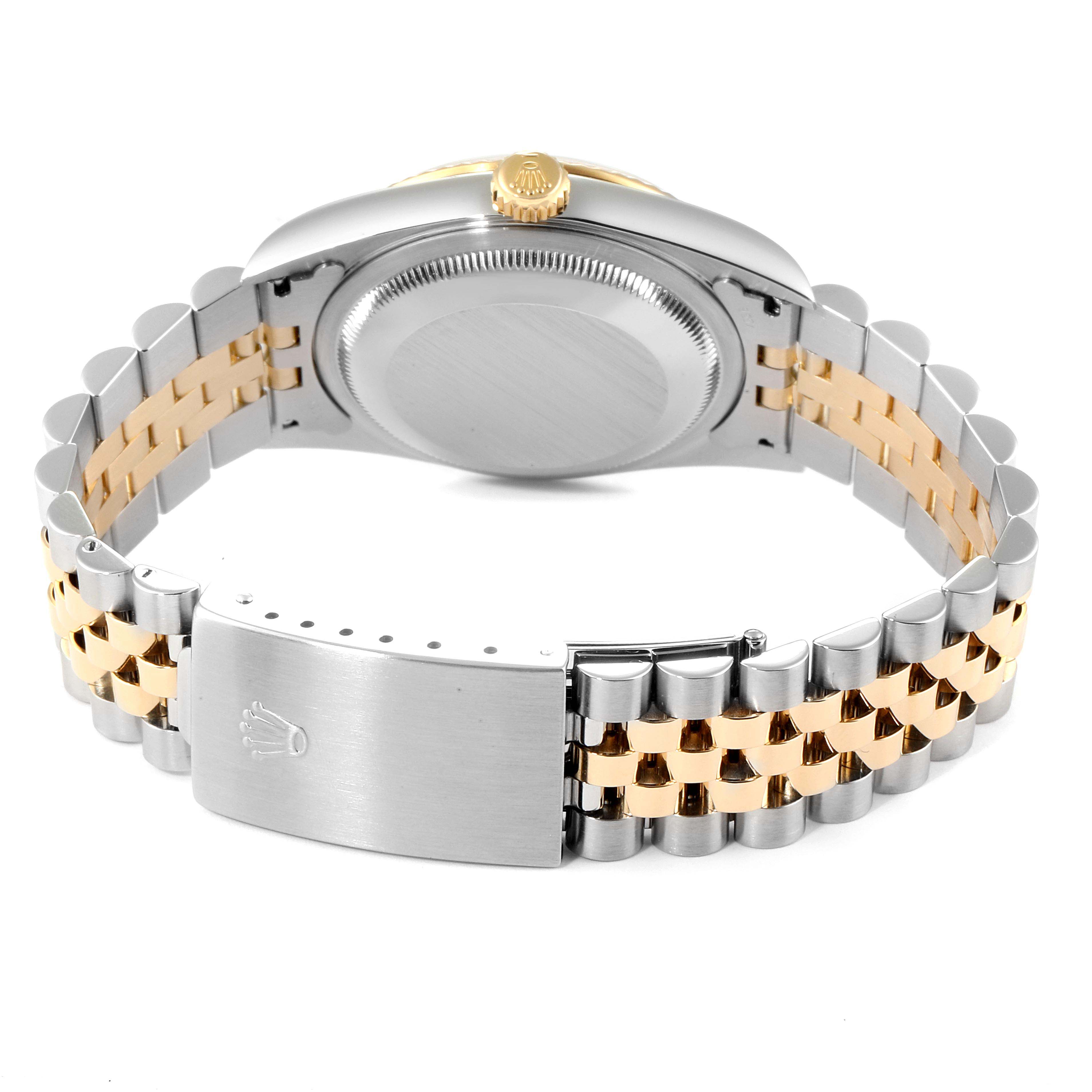 The image shows the back of a Rolex Datejust 16233 Men
s Steel and Gold (two tone) White Dial 16233 Men
s Steel and Gold (two tone) White Dial watch, highlighting its case back, crown, and Jubilee bracelet with a two-tone design.