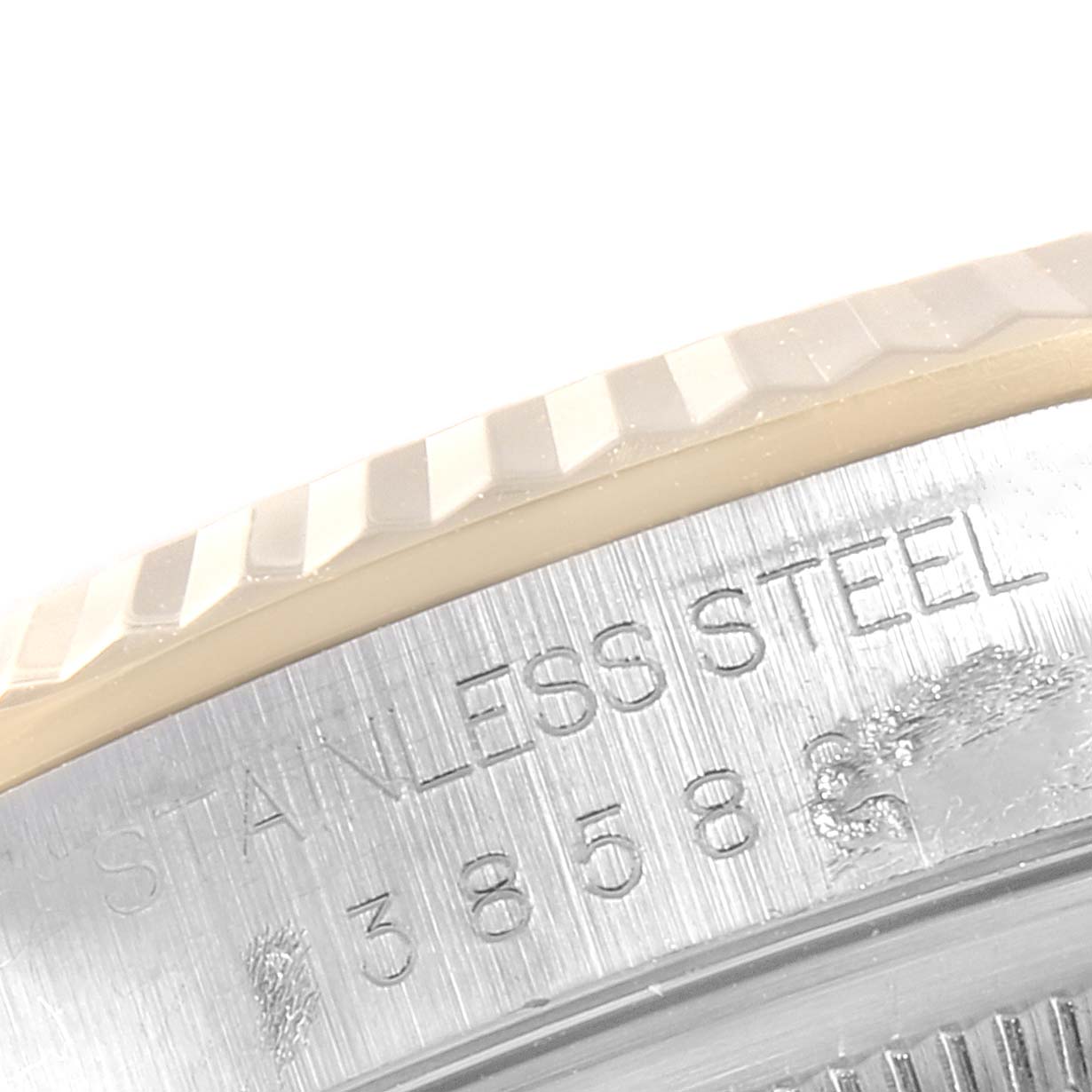 The image shows a close-up of the stainless steel bezel and part of the casing of a Rolex Datejust 16233 Men
s Steel and Gold (two tone) White Dial 16233 Men
s Steel and Gold (two tone) White Dial watch.
