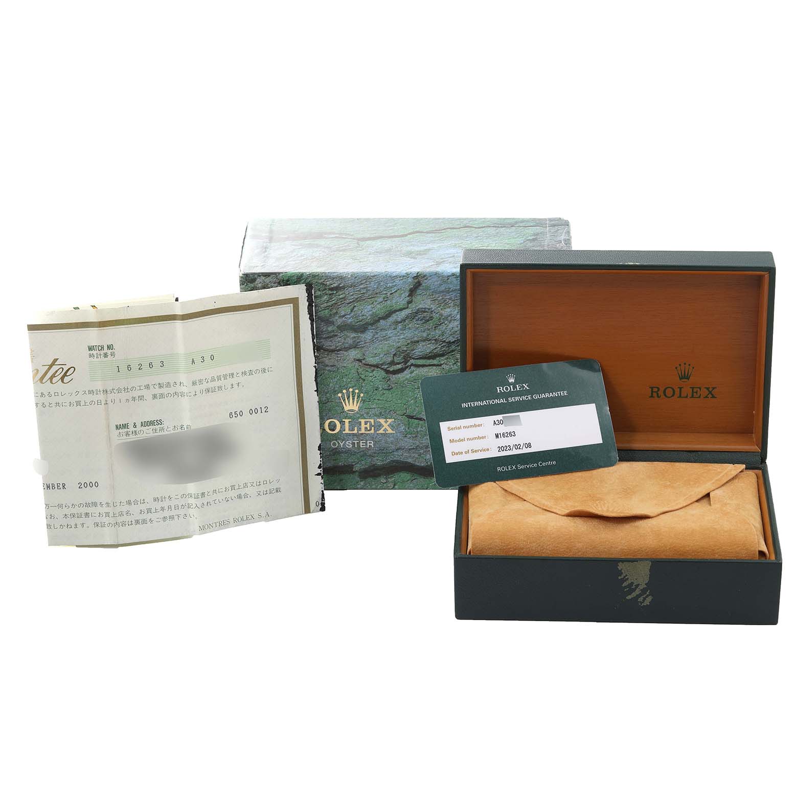 This image shows the packaging and documentation for a Rolex Turn-o-Graph 16263 Men
s Steel and Gold (two tone) White Dial 16263 Men
s Steel and Gold (two tone) White Dial watch, including the box, warranty card, and papers.