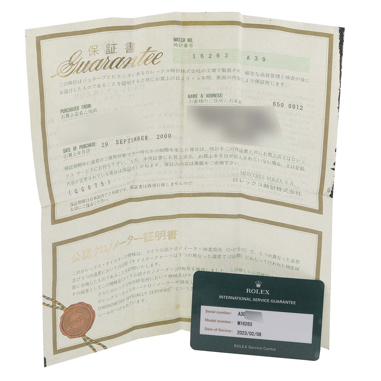 The image shows the guarantee paper and service card for a Rolex Turn-o-Graph 16263 Men
s Steel and Gold (two tone) White Dial 16263 Men
s Steel and Gold (two tone) White Dial model.
