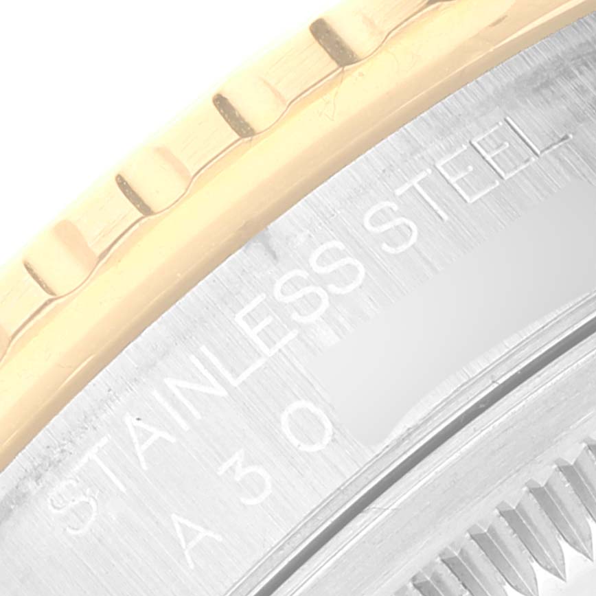 The image shows a close-up angle of the bezel and case back of a Rolex Turn-o-Graph 16263 Men
s Steel and Gold (two tone) White Dial 16263 Men
s Steel and Gold (two tone) White Dial watch, highlighting its stainless steel material and engravings.