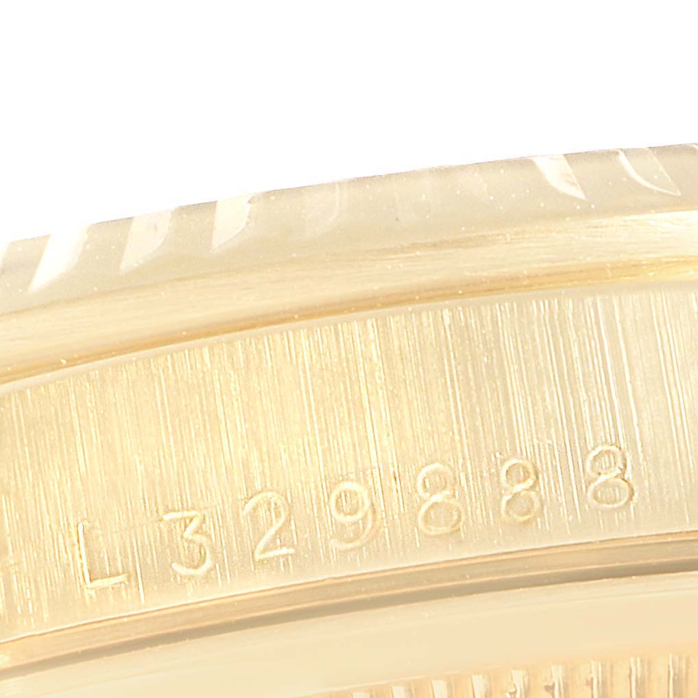 This close-up image shows the side casing and part of the serial number of the Rolex President 16238 Men's Yellow Gold Blue Dial 16238 Men's Yellow Gold Blue Dial model watch.
