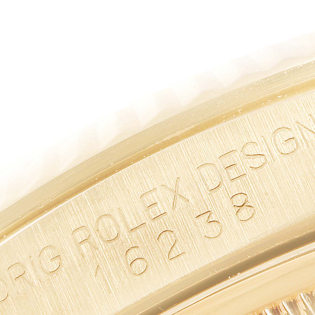 The image shows a close-up of the side of the bezel and case of a Rolex President 16238 Men's Yellow Gold Blue Dial 16238 Men's Yellow Gold Blue Dial model watch.