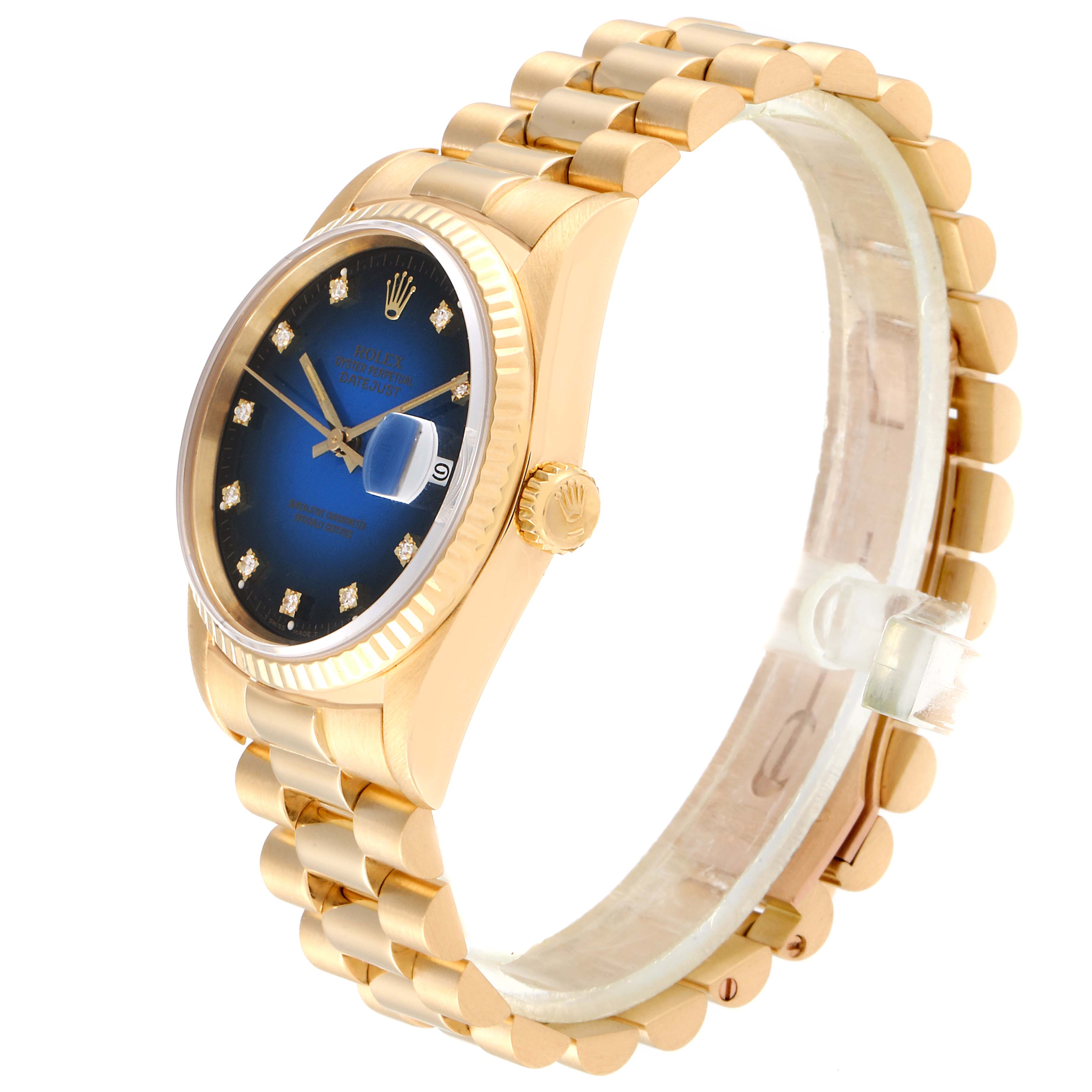 This Rolex President 16238 Men's Yellow Gold Blue Dial 16238 Men's Yellow Gold Blue Dial model watch is shown at an oblique angle, highlighting its gold case, blue dial, fluted bezel, and bracelet.
