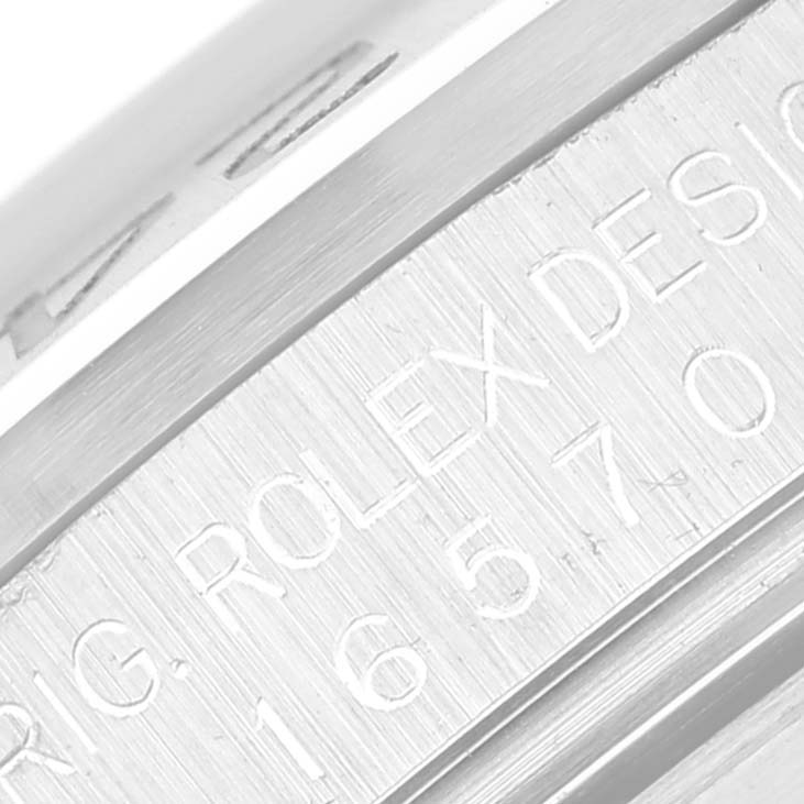 The image shows a close-up of the engraved side of the casing on a Rolex Explorer 16570 Men's Stainless Steel White Dial 16570 Men's Stainless Steel White Dial watch.