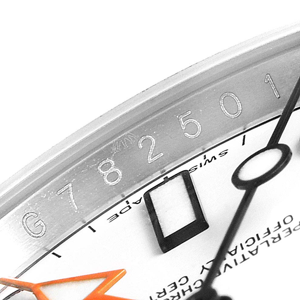 This image shows a close-up of the dial and part of the serial number of a Rolex Explorer 216570 Men
s Stainless Steel White Dial 216570 Men
s Stainless Steel White Dial watch.