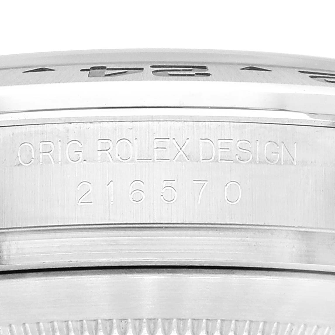 This close-up image shows the engraved model number and "ORIG. ROLEX DESIGN" inscription on a Rolex Explorer 216570 Men
s Stainless Steel White Dial 216570 Men
s Stainless Steel White Dial watch case side.