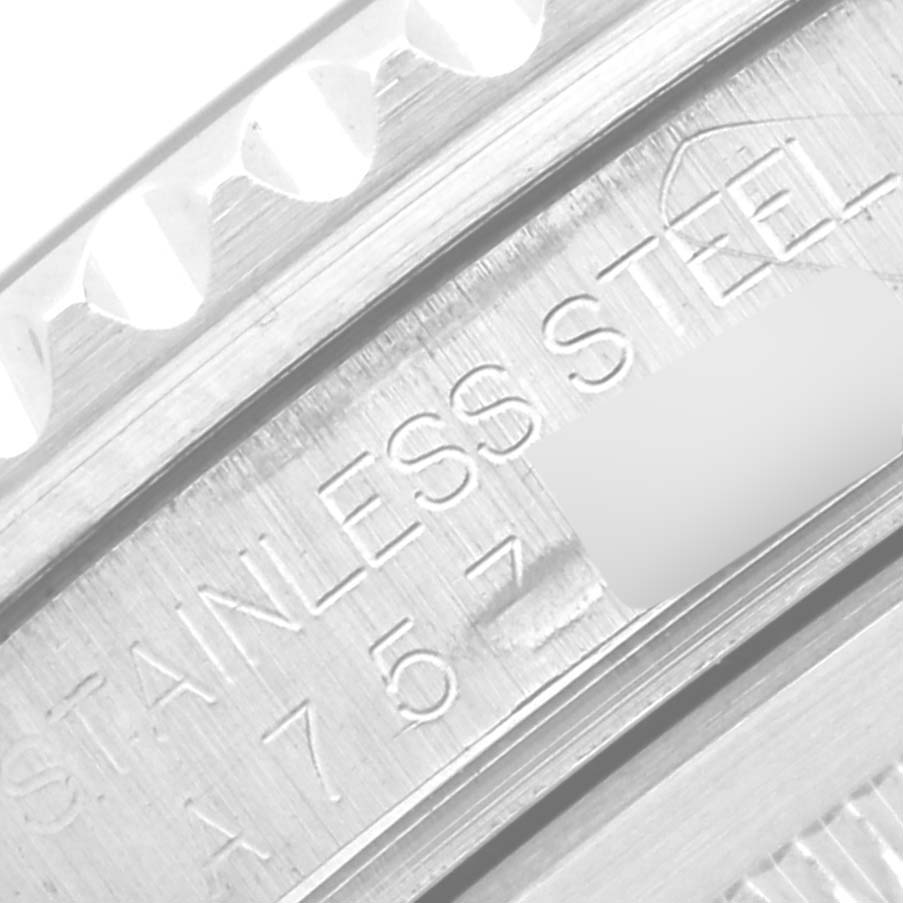 This image shows a close-up of the inner bezel and serial number of a Rolex GMT-Master 16700 Men's Stainless Steel Black Dial 16700 Men's Stainless Steel Black Dial watch, highlighting the "Stainless Steel" engraving.