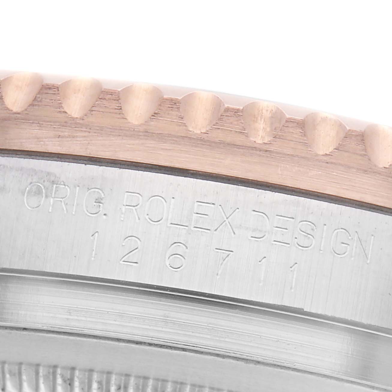 The image shows a close-up of the edge and side of a Rolex GMT-Master 126711 Men's Steel and Gold (two tone) Black Dial 126711 Men's Steel and Gold (two tone) Black Dial watch case, highlighting the engraved model number.