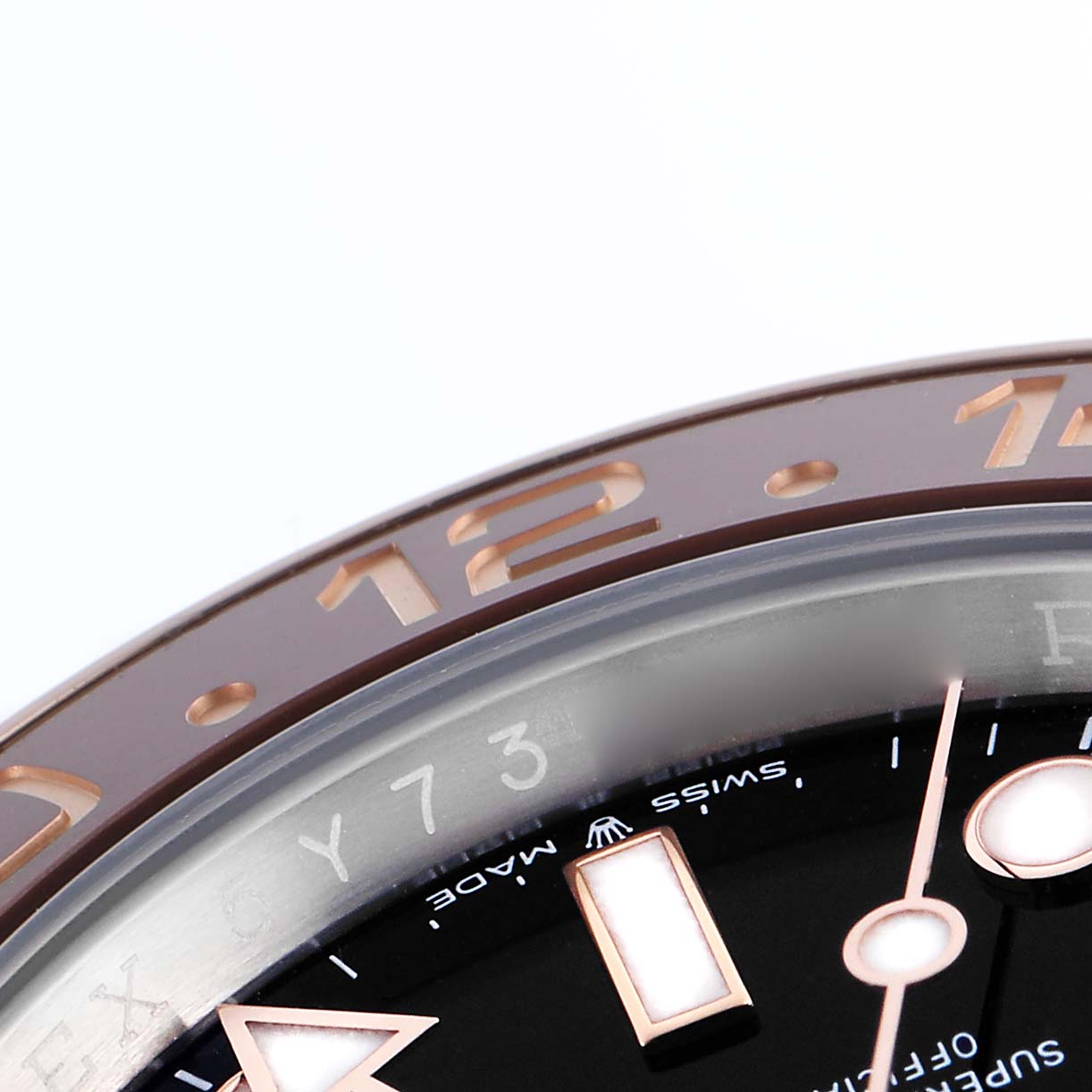 The image shows a close-up of the bezel and part of the dial of a Rolex GMT-Master 126711 Men's Steel and Gold (two tone) Black Dial 126711 Men's Steel and Gold (two tone) Black Dial, focusing on the hour markers and numerals.