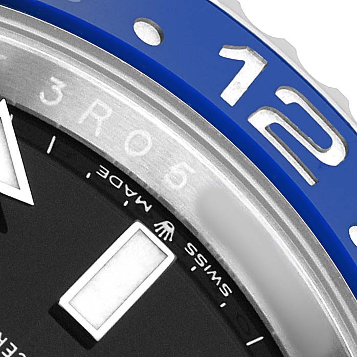 This close-up of the Rolex GMT-Master 126710 Men's Stainless Steel Black Dial watch shows part of the bezel with the numbers "1" and "2," and the edge of the dial with the "Swiss Made" text.
