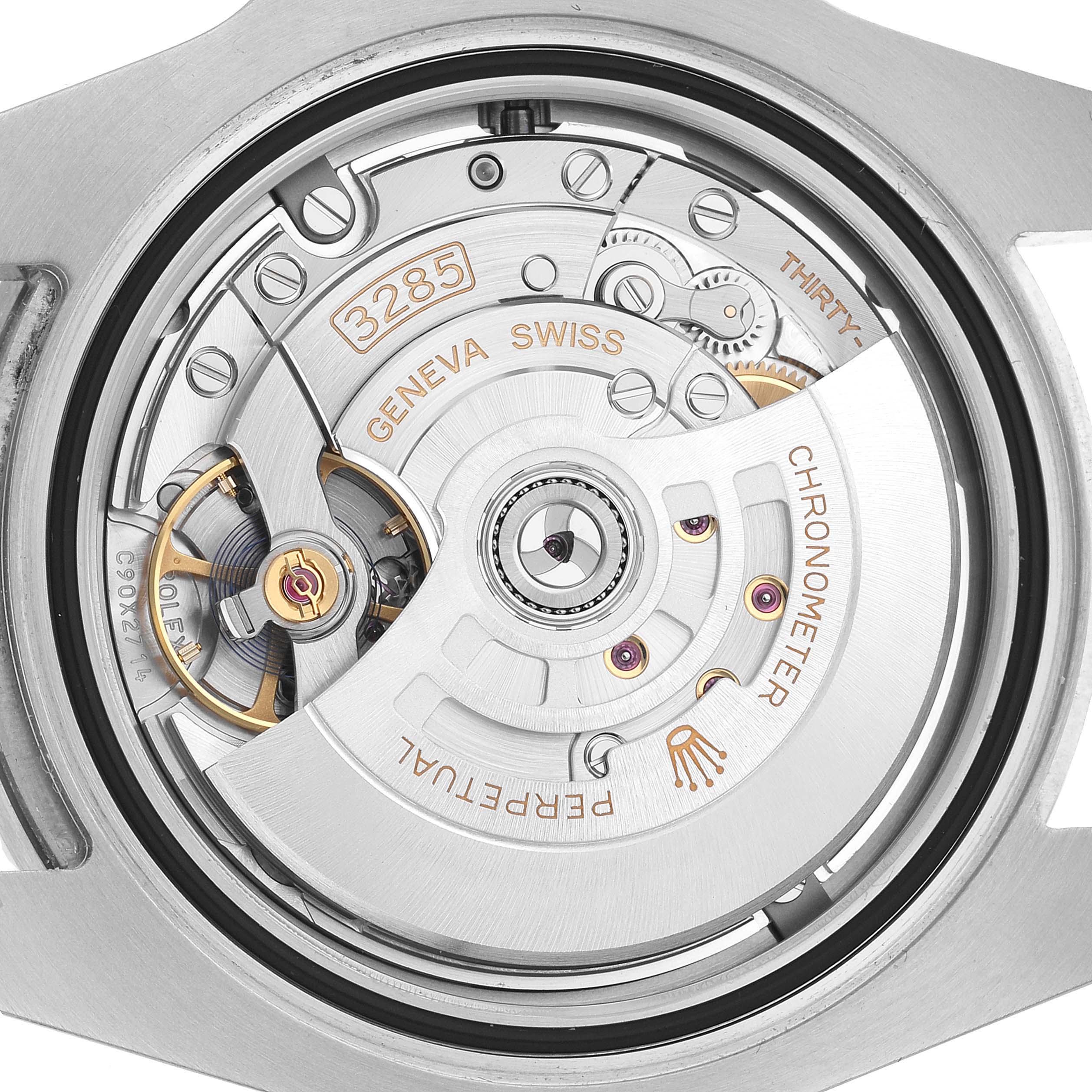The image shows the movement of the Rolex GMT-Master 126710 Men's Stainless Steel Black Dial, focusing on the intricate gears and rotor from the back view.